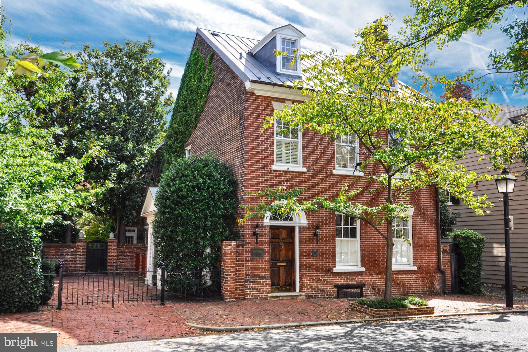 Historically significant detached brick house with new copper roof on 2 lots in prime location w/smokehouse, recent renovations, sun-filled rooms, 2+ car Pkg! Beautiful gardens surround this unique property that enjoys the ultimate in privacy & southern exposure. Hi ceilings, heart pine floors & period woodwork add to the gracious 18th C. rooms w/integrated 21st C. amenities for a grand residence.