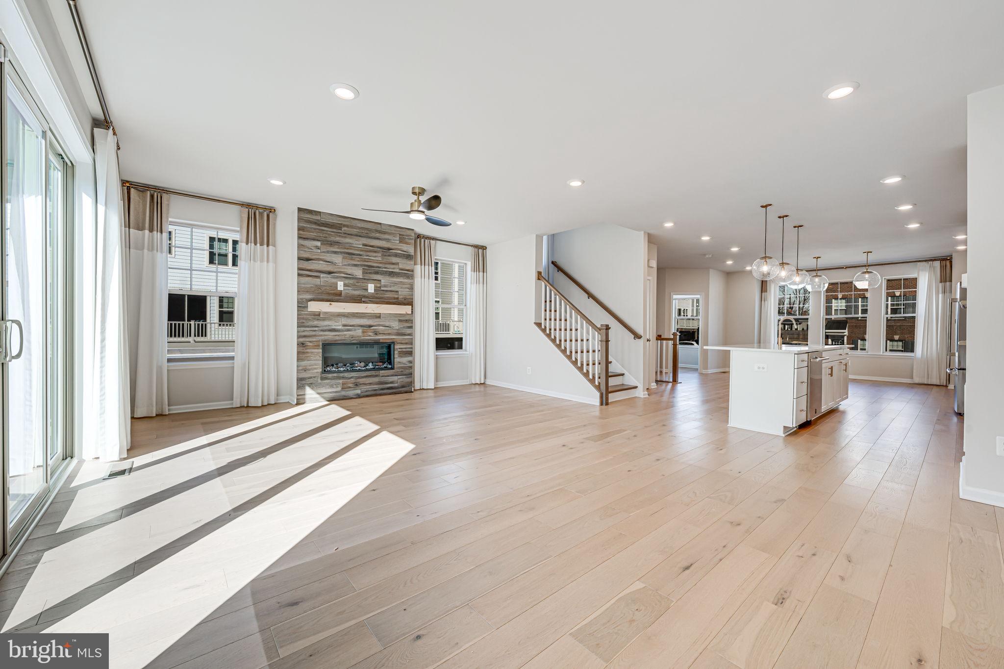 3 bedrooms, 3.5 bathrooms, a cozy family room, and a spacious two-car garage. The expansive open-concept design features a large dining area seamlessly connected to the kitchen and living room, complete with a charming fireplace. The luxurious master suite boasts a generous walk-in closet and an en-suite bathroom with a walk-in shower. The upper-level loft offers its own private balcony, while ample storage throughout ensures effortless organization.

Experience unparalleled luxury in this brand-new, never-lived-in corner model townhome, ideally nestled in the heart of Historic Old Town Manassas! This exquisite four-level residence offers an exceptional blend of elegance and modern convenience, featuring three generously sized bedrooms, 3.5 beautifully appointed bathrooms, and a sophisticated open-concept design that effortlessly balances style and functionality.

Step into a sun-drenched living space adorned with high-end finishes, and designer details that create a bright and airy ambiance. The formal dining area, inviting family room, and versatile loft provide ample space for both relaxation and entertaining. Multiple outdoor retreats—including a private deck and balcony—offer the perfect setting for morning coffee or evening unwinding.

Enjoy the ease of a spacious two-car garage and an unbeatable location just steps from the VRE, boutique shopping, award-winning dining, and a vibrant calendar of year-round events.

Be the very first to call this extraordinary residence home. No smoking, no pets.