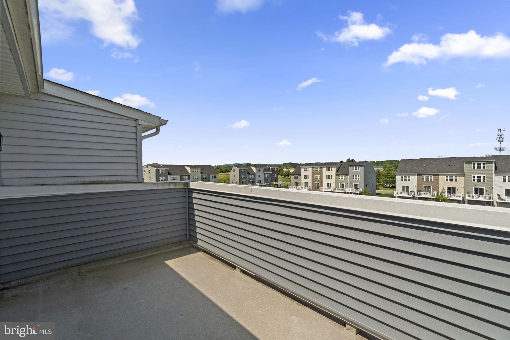*** 2.99% ASSUMABLE MORTGAGE ***  Welcome to 5278 Black Locust Drive! This 4-story, modern townhome is nestled in the Ballenger Run community.  A sun-soaked home with 3 bedrooms, 3.5 bath and a rooftop terrace, this Clarendon model offers an open floor plan with many upgraded selections throughout. Elegant and durable luxury vinyl plank flooring runs throughout the living areas, with brand new carpet in bedrooms, stairs and entry level family room.  Each of the 3 bedrooms offer a full en-suite bathroom and a walk-in closet.  Laundry (washer and dryer included) is located on the bedroom level.  Access the rooftop terrace from the top level, 3rd bedroom for ultimate privacy and expansive views.  The rear-load garage provides private parking and offers a personal EV charging station for at-home vehicle charging!  Additional parking available in driveway and parking lot.  Ballenger Run is located just outside the city limits of Frederick and EXEMPT from city taxes, with easy access to local amenities, schools, parks and commuter routes.  Community amenities include a beautiful community center, outdoor pool, fitness center and party room available to host friends and family for larger events, as well as lawn care and snow removal.