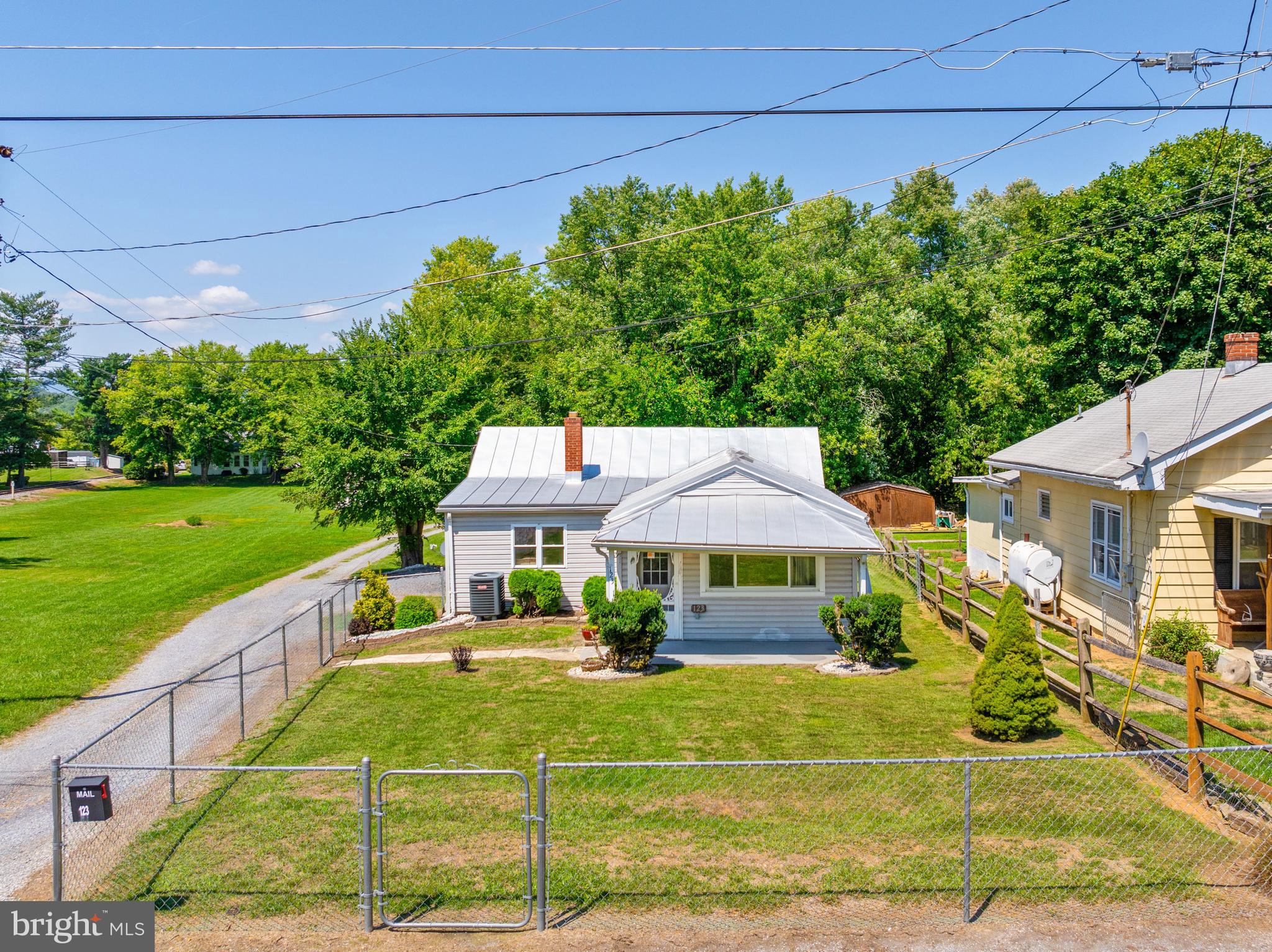 Discover this charming home featuring two spacious bedrooms and one bathroom, with over 1,200 square feet of comfortable living space. Recent renovations include countertops, new flooring, a refreshed shower, and upgraded 16-inch  insulation for added energy efficiency. The unfinished basement provides ample storage options. Outdoors, you’ll appreciate the covered front porch and the privacy of a fenced front yard. A detached two-car garage adds convenience, all set on a quarter-acre lot just minutes from downtown Winchester.