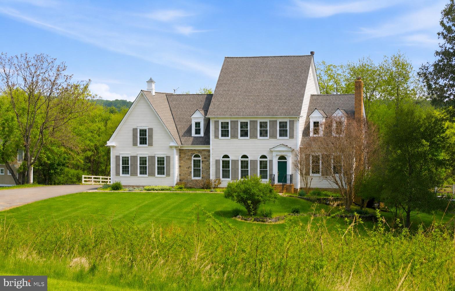 Price Improvement -NO HOA,10 Acres with pool,   Private setting  outside the historic village of Waterford Va. has rolling pasture and mature woodland, this exceptional residence offers a refined blend of timeless craftsmanship and elevated country living.  A resort-inspired pool —enhanced by extensive upgrades completed in 2025—is thoughtfully integrated into the natural landscape, while dual Trex decks overlook lush grounds, creating a seamless indoor-outdoor lifestyle ideal for sophisticated entertaining. Inside, rich American cherry floors, soaring ceilings, and artisan-crafted millwork define the home’s elegant character, enhanced by fresh paint throughout and all new windows and exterior doors. The sun-filled eat-in kitchen, appointed with new appliances, opens effortlessly to the deck, while the sunken family room—anchored by a dramatic stone fireplace and custom built-ins—features a wall of glass framing sweeping pastoral views. A gracious living room with fireplace and built-ins, along with a private study opening to its own deck, provide both intimate and formal living spaces. The upper level offers three luxurious ensuite bedrooms with walk-in closets, complemented by an expansive skylit bonus room.  Additional amenities include a run-in shed with electricity, a detached workshop with loft, an attached two-car garage, and a well-maintained HVAC system (approximately 7 years old)—completing this rare offering where privacy, beauty, and thoughtful design converge.
