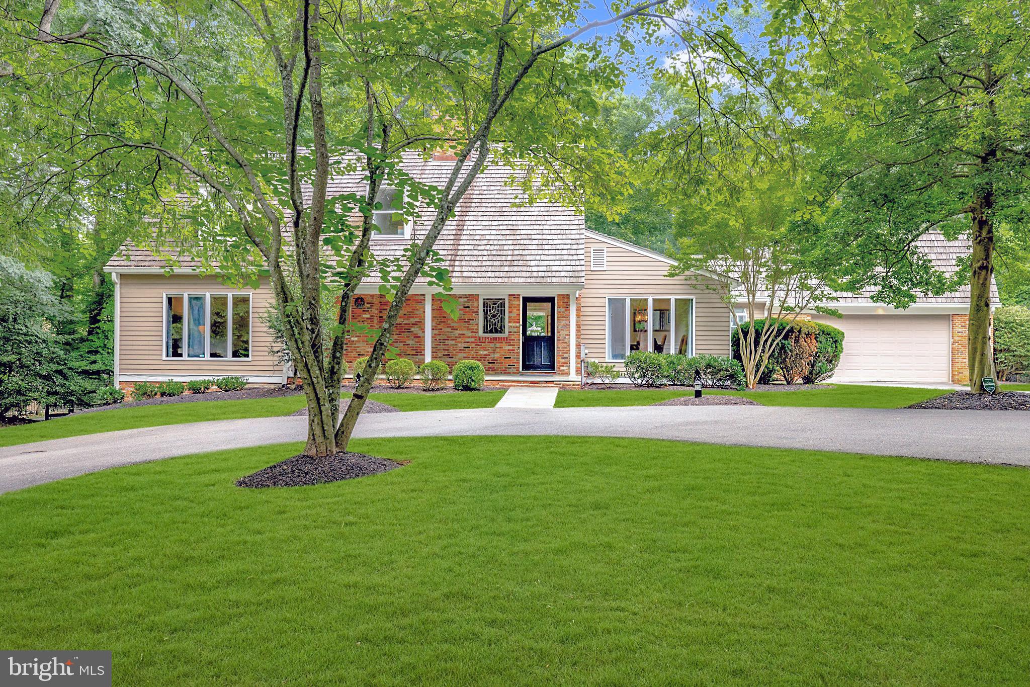 IMPROVED PRICE. Introducing 11311 South Glen Road, a charming John duFief home custom built for his family in Potomac, Maryland highlighting beautiful architectural details throughout. Step into elegance and sophistication with this five bedroom, three and a half bathroom home that features a renovated Jennifer Gilmer kitchen, main level primary suite, and a fully fenced yard complete with expansive hardscaping.

Enter the main foyer adorned with sleek slate flooring, an abundance of natural light, and the conveniently situated, main-floor powder room. An expansive dining room with custom trim work provides the perfect space for hosting a larger group. The kitchen is a chefs dream, equipped with masterfully disguised, top-of-the-line Miele appliances, including a six-burner cooktop, built-in espresso/coffee system, pull-out freezer drawers, and a fully integrated dishwasher. Complete with white, gold, and pale wood accents, the bright kitchen exudes elegance. The white wall cabinets and appliance garages are all opened on bi-fold hinges for added convenience, allowing them to be left open while cooking. The quartz countertops, large island, and an adjacent eat-in area wrapped in windows creates a bright and socially comfortable space with immense amounts of storage. Access to the back patio and peninsula overlooking the living room makes this home the perfect open floor plan. Step down into the family room wrapped in gleaming hardwood flooring, a stone surround wood-burning fireplace, and floor-to-ceiling windows, offering the ideal blend of comfort and elegance. Continue into an enclosed office highlighting a wood-burning fireplace wrapped in exposed brick and charming wood beam ceiling offering a tranquil retreat with convenient access to the back patio. Completing the main floor is the luxurious primary suite, boasting a walk-in closet and appointed dual vanity bathroom with walk-in shower. Ascend to the upper level where hardwood flooring continues to impress. Three bedrooms and a full bathroom with a shower and tub round out this floor. The lower level offers the ideal setup for additional lounge and recreation space where a bedroom and fully renovated bathroom can be found. With convenient walk-up access to the backyard, this level provides a perfect setting for entertainment and relaxation. The vast oversized slate patio is complete with a charming wooden pergola, ideal for outdoor gatherings. The patio opens up to an expansive, tree-lined yard and garden, offering a serene escape from the bustle of everyday life. This 1.3 acre-lot backs to wooded green scape and hosts a generously sized storage shed, perfect to tuck away any larger items.

Don't miss the opportunity to call 11311 S Glen Road your new home. Experience the pinnacle of contemporary living in this exquisite Potomac residence. Schedule a private tour and embrace a lifestyle of unparalleled luxury and comfort.