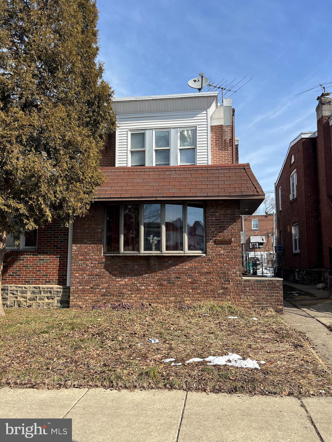 Welcome to 3403 Tyson Ave – a beautifully maintained brick-front twin located in the heart of West Mayfair in Northeast Philadelphia.

This spacious 3-bedroom, 2 full bath home offers comfort, style, and exceptional outdoor space — complete with a rare detached 2-car garage.

Enter through the enclosed and heated tiled front porch, the perfect year-round bonus space, featuring elegant French doors that open into a bright and inviting living room with ceiling fan. The main level continues into a formal dining room adorned with a tasteful chandelier and seamlessly flows into the updated open-concept kitchen. The kitchen is designed for both everyday living and entertaining, showcasing an abundance of cabinetry, granite countertops, glass tile backsplash, center island, and stainless steel appliances.

Upstairs, you’ll find three generously sized bedrooms along with a well-appointed 3-piece ceramic tile hall bathroom.

The fully finished lower level provides fantastic additional living space, complete with a full bathroom and a separate laundry area — ideal for a family room, guest suite, home office, or recreation space.

Step outside to enjoy the covered rear patio, expansive concrete yard, and the highly desirable detached 2-car garage offering secure parking and additional storage.

Investment Opportunity: The property is currently rented on a month-to-month lease at $1,600 per month (below current market value) to excellent tenants who would love to stay, offering immediate income potential. However, the home can also be delivered vacant for an owner-occupant buyer.

Whether you're looking to expand your investment portfolio or purchase a move-in ready home with built-in rental flexibility, this West Mayfair gem checks all the boxes.