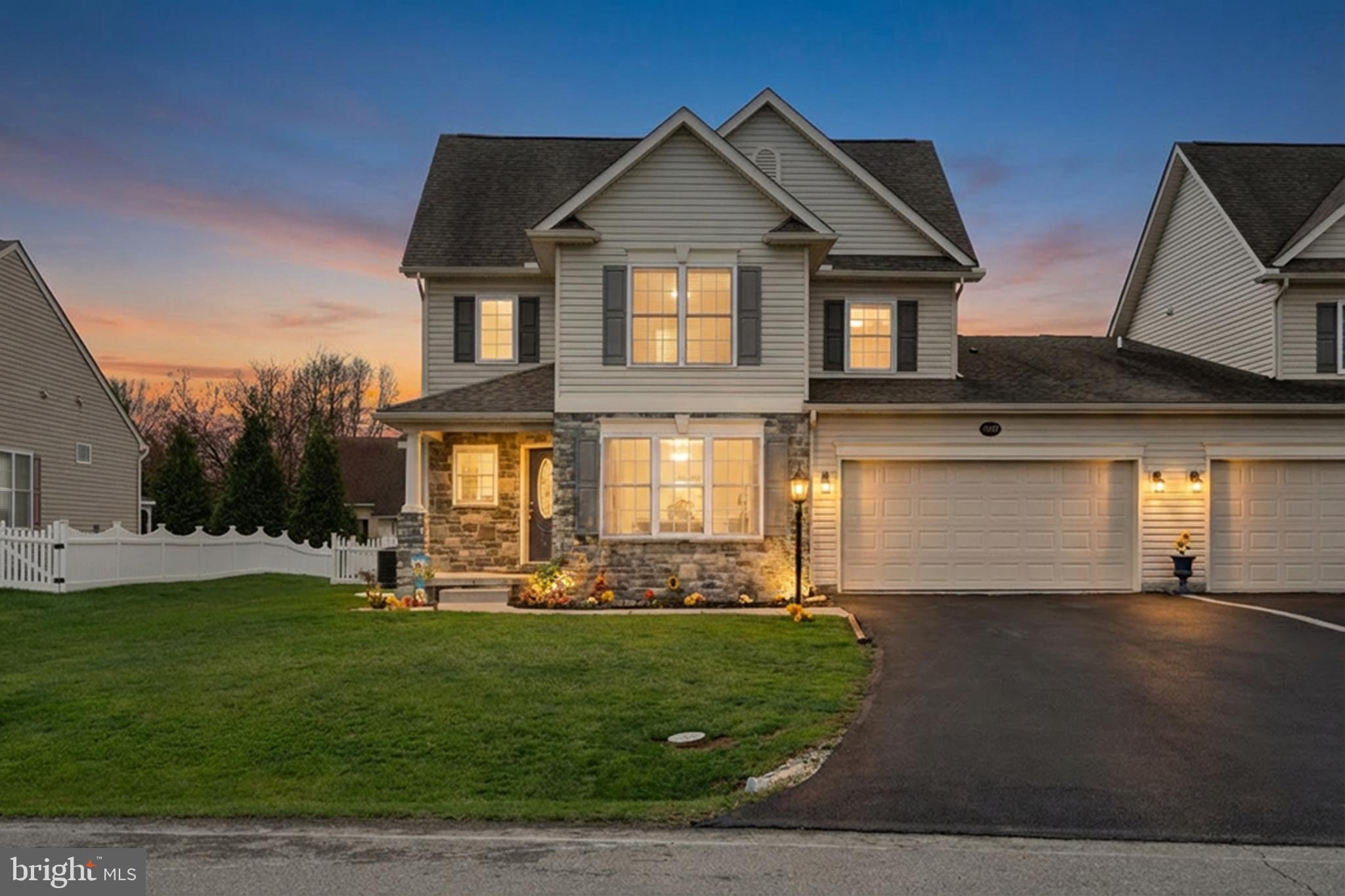 Custom built stone villa in Freedom Hills community.  Spacious open floor plan features a gourmet kitchen with stainless steel appliances flowing into the family room with grand vaulted ceilings and gas fireplace.  A glass door in the family room opens to a fenced back yard with paver patio and awning. The large primary bedroom includes a walk-in closet and en suite.  French doors open to an office filled with natural light. The main level also offers a half bath and laundry.  Overlooking the main level is a loft offering flexible living or working space.  Two additional bedrooms with walk-in closets and a full bathroom complete the upper level. A full, insulated, unfinished basement with walkout is perfect for storage or can be completed in the future to your specifications for additional living space. An attached two car garage completes this home. You won't find a home THIS large, and THIS well maintained, at THIS price! Come tour your new home today! **One owner must be at least 55 years old.**