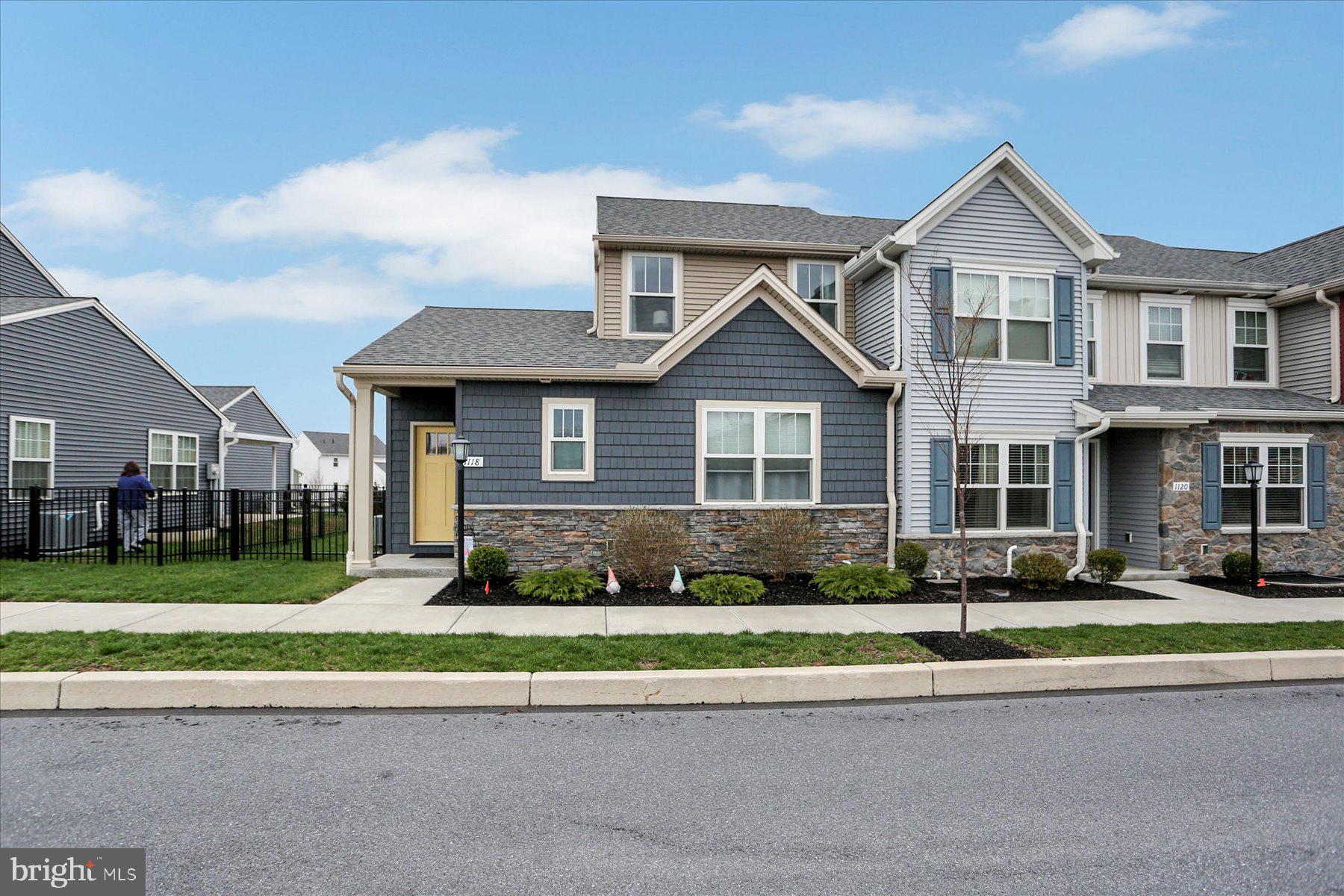 Welcome to the small-town charm of Union Station, offering an array of amenities, shopping, dining, a brewery, and scenic walking trails—all just steps from your front door.  It's a vibrant life-style you'll want to experience!  This beautifully designed end-unit townhome features two spacious primary suites, one on each level—perfect for flexible living arrangements or hosting guests. The main floor boasts an open-concept layout with soaring 9-foot ceilings, flooding the space with natural light. The stylish kitchen is equipped with granite countertops, stainless steel appliances, gas cooking, a pantry, a breakfast bar for 3, and plenty of space to cook and entertain.  Enjoy the warmth and durability of luxury vinyl plank flooring throughout the main living areas, with plush carpeting in the bedrooms for added comfort. The oversized garage comfortably fits two mid-size SUVs with extra room for storage. The large unfinished basement, complete with an egress window, is a blank canvas ready for your personal touch—whether you’re dreaming of a home gym, media room, or extra living space.  Additional highlights include a main-level laundry room with washer and dryer included, and a fenced yard with an expanded patio, ideal for pets and outdoor relaxation.