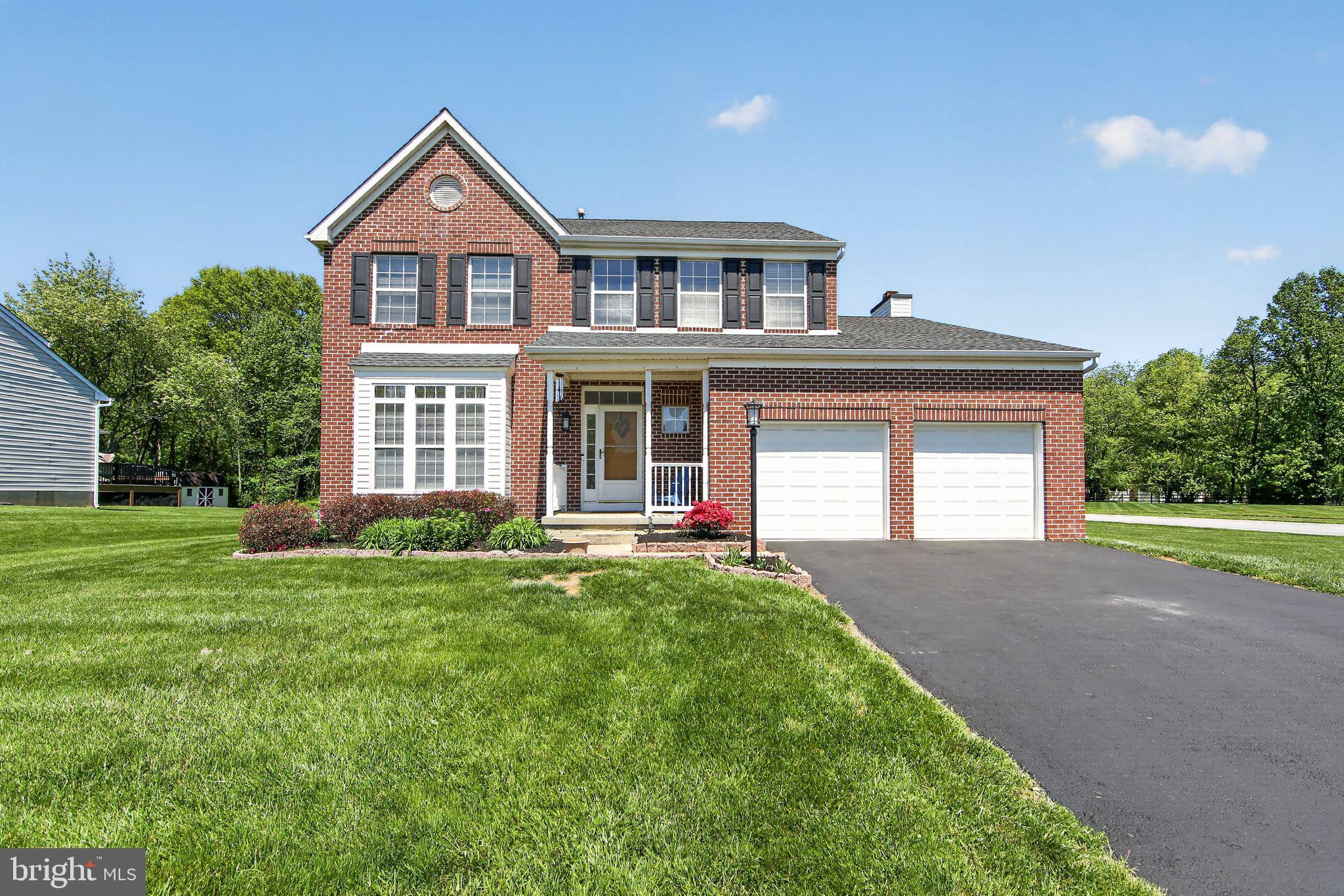 A beautiful brick and siding Colonial home in a prime location, conveniently situated near major points of interest, parks, recreation, shopping, and entertainment. This home features desirable updates and a thoughtfully designed floor plan. Upon entry, you’re welcomed by a dramatic two-story foyer that opens into a spacious living and dining room combination. From there, you’re led into the stunning, showstopper kitchen, complete with upgraded cabinets and appliances, a center island, eat-in area, pantry, coffee bar, and elegant hardwood flooring. The kitchen flows seamlessly into the inviting family room with a cozy fireplace, as well as a screened-in porch—perfect for relaxing or entertaining. The second floor offers three generously sized bedrooms and two full bathrooms. The primary suite features vaulted ceilings, a walk-in closet, and an updated en-suite bathroom with a walk-in shower and double sinks. The finished lower level expands your living space with an additional bedroom/office, full bathroom, and a versatile game room, along with ample storage. The home also includes gas heat and a tankless hot water heater, conveniently located in the storage area. All of this is set on a picturesque ¾-acre corner lot backing to woods, offering privacy and natural beauty. Schedule your showing today—you won’t be disappointed.