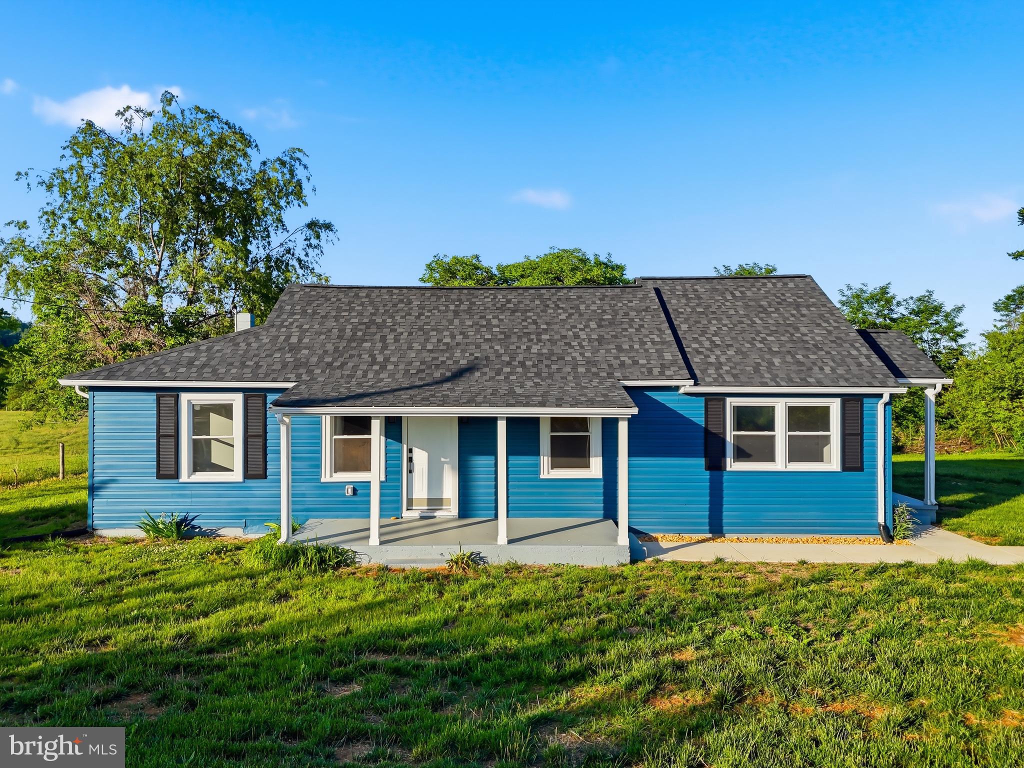 This newly renovated 3-bed, 2-bath home in Madison County makes it easy to picture your life here, waking up to panoramic mountain views, sipping coffee on your deck, and coming back to a space that feels warm and effortless. Inside, the granite countertops and luxury vinyl plank flooring throughout add a clean, modern feel that’s both beautiful and practical for everyday living. The open layout provides you with ample space to breathe, relax, and make the home your own from the very start. With a new roof, HVAC, appliances, insulation, deck, sidewalk, doors, and flooring. This beautiful home features spacious rooms and incredible views right outside your door. This is the kind of place where settling in feels natural.