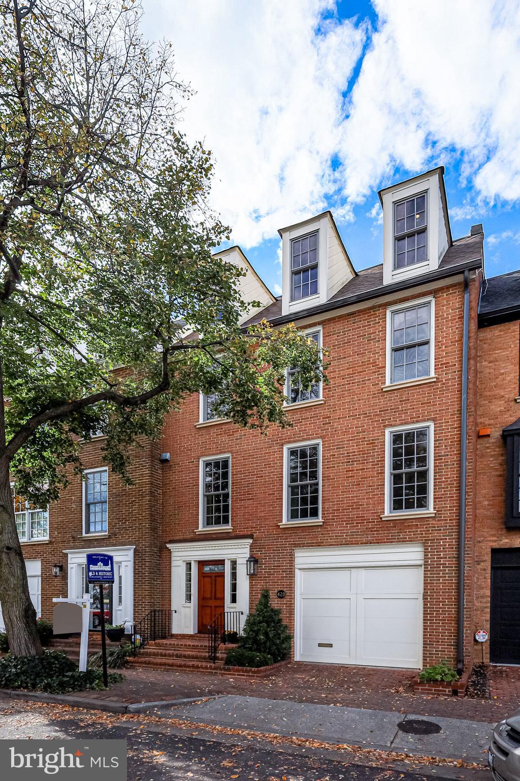 Price reduced! Rare opportunity to live in the historic district of the City of Alexandria fronting on Founders Park and the Potomac River.  With 4 bedrooms, 4 full baths, this stunning  3300 sq feet 4 level townhome has been thoughtfully renovated with over $450K of high-end touches over the past few years.  It offers a versatile floor plan that can easily accommodate all styles with a mix of entertaining spaces and comfortable private living.  In addition to an amazing river front location, this home comes with a one- car garage and  a separate deeded off-street parking space. 

The relaxed elegant ambiance is created by the beautiful hardwood flooring and the exquisite millwork throughout.  You are welcomed into a large foyer with beautiful marble and wood inlay floors leading to a large family/media room with built-in shelving and a fully renovated bath,

walk up to an exquisite living room with a 14 foot high tray ceiling, a woodburning fireplace flanked on both sides with large custom lighted built ins. The elegant 8 foot custom French doors  lead onto a private patio with in-ground irrigation for the border gardens. 

The very generous dining rom overlooks the living room, offering a perfect setting for entertaining.  It adjoins a renovated gourmet kitchen with stainless steel appliances, including an induction cooktop. The flow from kitchen to dining room to living room is perfect for daily living or entertaining. 

The upstairs third level has a spacious master suite complete with hardwood floors and a fully renovated master bath with a large walk-in shower and marble floors.  The second large bedroom on this level has a wall of built-in shelves with allows the option to use this room as a bedroom, den or office.  A second fully renovated bath is adjacent to this bedroom. 

the top floor has two more bedrooms and a very large bath/laundry room. this bathroom has a large skylight witch brings in an abundance of natural light.  the front bedroom has 3 dormer windows offering a stunning unobstructed view of the Potomac river and Founders Park with a second skylight bringing in more natural light.  The back bedroom has wooden shutters and 3 large closets for extra storage.
this immaculate home is historic Old Town living at its best.  This location is exceptionally convenient to river front dining, shopping bike and walking trails, the airport, DC and all the charms of Alexandria's Old Town. There are no additional HOA fee expenses