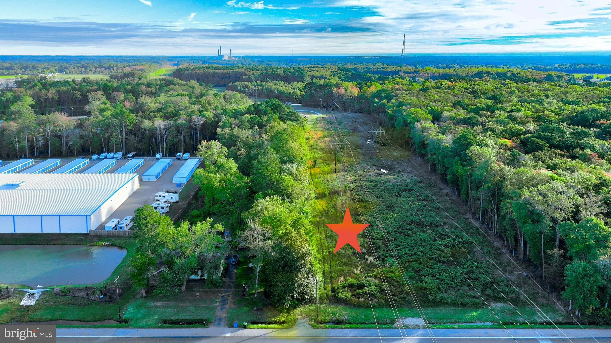2.9 acre land parcel with approximately 200 feet of frontage along high-traffic US Highway 113. The property offers excellent visibility and approximately 1.5+ acres of usable land, providing flexibility for future development. Roughly three-quarters of the parcel is zoned General Commercial (C-1), allowing for a variety of potential commercial uses while also offering the possibility for an owner-occupied setup, subject to zoning and approvals. The site is well-suited for those seeking land with commercial exposure and room to build.  Survey and easement agreement attached. Buyer to conduct all due diligence regarding zoning, permitted uses, residential allowances, and utility availability.