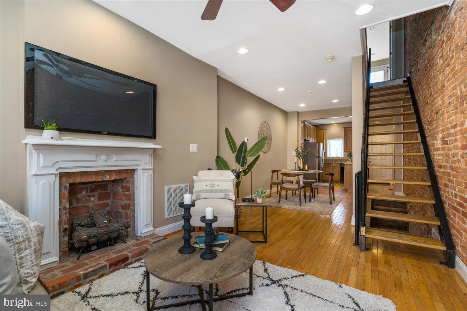 This Is A Beautiful Baltimore Townhome, With 2 Bedrooms, 1  Full Bathroom Located In Federal Hill. Walk In and Be Greeted By A Lovely Living Room With Gas Fireplace & Dining Room Combination .Continuing Throughout The Home Is The Kitchen Which Offers Brand New Stainless Steel Appliances,  Granite Countertops, & Kitchen Island. The  Upper Level Includes A Spacious Primary Bedroom With Closet,  & Recessed Lighting, A Hallway Bathroom With A Large Vanity Sink &Tile Flooring. The Back Secondary Room Includes, Recessed Lighting, Closet, Exposed Brick and Entrance To A Spiral Staircase That Leads Up To The Rooftop Deck! The Lower Level Offers A Partially Finished Basement, Perfect For Additional Storage & Laundry Room.  Bonus Features Include: 2 Car Parking Pad, New Bath Tub, New HVAC/AC, New Storm Doors& Sump Pump.