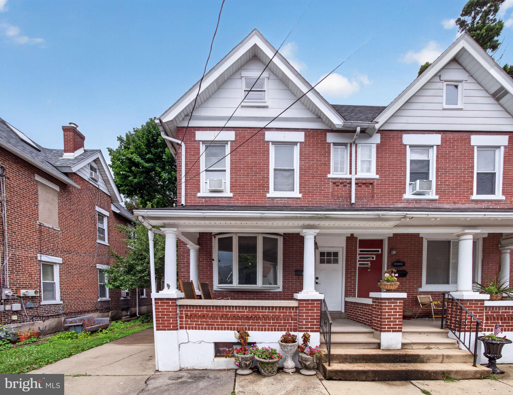 Join us for an OPEN HOUSE, Saturday July 25th 1-3pm! Welcome to this brick, twin home in the heart of Emmaus! Highlights include four bedrooms, 1.5 baths, and an off-street parking pad. The spacious living and family/dining rooms are filled with natural light, creating a warm and inviting atmosphere. The eat-in kitchen offers plenty of space for dining, a built-in pantry, and a ceiling fan, with convenient access to the mudroom / enclosed back porch. Upstairs, you'll find three generously sized bedrooms and a full bath. The finished third-floor offers flexible living space that can serve as a fourth bedroom, home office, or playroom. Many rooms offer ceiling fans and large windows for added comfort and abundant natural light. Outside, enjoy the covered front porch, perfect for relaxing with your morning coffee or unwinding in the evening, along with a cute backyard that's ideal for gardening, entertaining, or simply enjoying the outdoors. Enjoy the convenience of being within walking distance of downtown Emmaus shopping, restaurants, and everyday amenities. This well-maintained home offers comfort, character, and a fantastic location in the desirable East Penn School District!