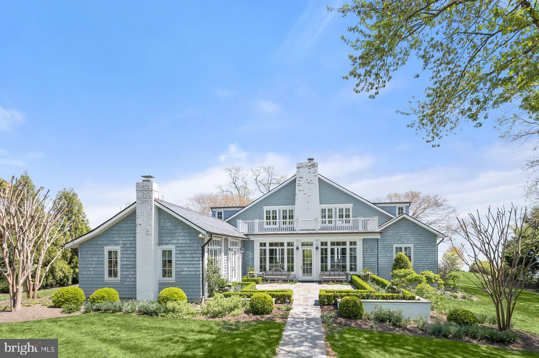 Perfectly positioned just steps from the iconic Gibson Island Point, 817 Broadwater Way captures timeless coastal charm with captivating sunrise views over the Chesapeake Bay and Baltimore Light. Originally built in 1927 and carefully updated over time, this exceptional waterfront cottage pairs historic character with sophisticated modern design.

Set on a picturesque 0.7-acre (30,492 sq ft) lot, the property offers privacy, sweeping lawn space, and direct water access via private steps leading to the shoreline. The cedar shake exterior, slate roof, striking stone chimney, and blue stone walkway openings to a charming bluestone terrace, and lantern-lit entry create a memorable arrival, framed by mature boxwoods, flowering vines, crepe myrtles, and seasonal daffodils.

Inside, 2,867 square feet of curated living space reflects a polished coastal aesthetic, featuring designer wallpaper, tailored lighting, and carefully selected fixtures throughout. Expansive windows and glass doors welcome abundant natural light while framing tranquil water views from multiple vantage points.
The residence offers five bedrooms and four full bathrooms, providing versatility for guests, family living, or work-from-home needs. Seamless indoor-outdoor flow leads to the expansive waterside lawn and inviting terraces, ideal for enjoying the serene Bay setting.

Additional highlights include a spacious driveway and golf cart garage, supporting the relaxed island lifestyle that defines Gibson Island living.

817 Broadwater Way represents a rare opportunity to own a turnkey waterfront retreat in one of the Chesapeake Bay’s most sought-after private communities.

Information on Gibson Island:
Gibson Island is a private island within one hour of Washington, D.C. and Baltimore offering an absolutely extraordinary setting.  The Island comprises 1000 acres with seven miles of shoreline. Two thirds of the Island is undeveloped and is owned by the Gibson Island Corporation, the homeowners' association.  The remaining third is residential home sites. 

Gibson Island is located on the western shore of Maryland, so there is no need to cross the Bay Bridge. On the Island is a 43-acre spring fed freshwater lake in which one may enjoy non-motorized watercraft activities such as paddleboarding, canoeing, kayaking, fishing and swimming.  

The Island offers enormous privacy and security--there is an entry gatehouse staffed 24+Hours, and the Island is patrolled by the Gibson Island Police Force (GIPD).  The Gibson Island Corporation Service Department offers yard maintenance and landscaping and other services for homeowners.  There is a full-service yacht yard.   From the Island, it is just a 20-minute drive to BWI Airport and the neighboring Amtrak train station.  

The Island houses a private country club (membership by invitation) offering yachting, fine dining year-round, tennis, an award-winning Charles Blair Macdonald designed 9-hole golf course, swimming, croquet, skeet shooting, and more.  (C)