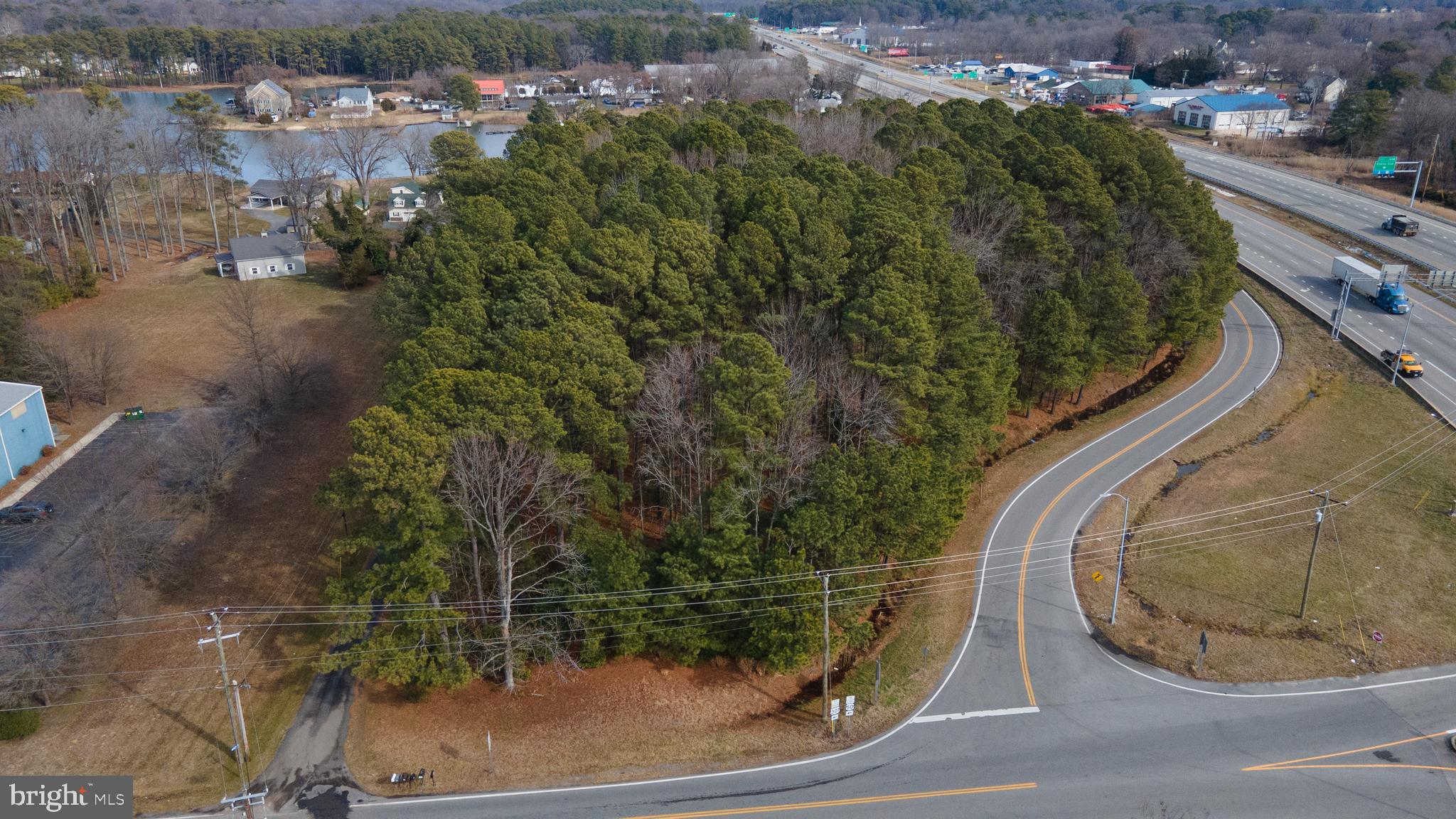 Grasonville - Developer and Investor Alert:   Prime retail or office space development zone UC also waterfront.   Great location on the  northeast corner of US Route 50 and VFW Avenue - with easy exit to highway.  There are two lots with ready potential for reconfiguration as desired. There are no restrictions on clearing woods.   Public Sewer at the property and available. There are 900 linear feet frontage and an access lane on the north side of US Route 50 .