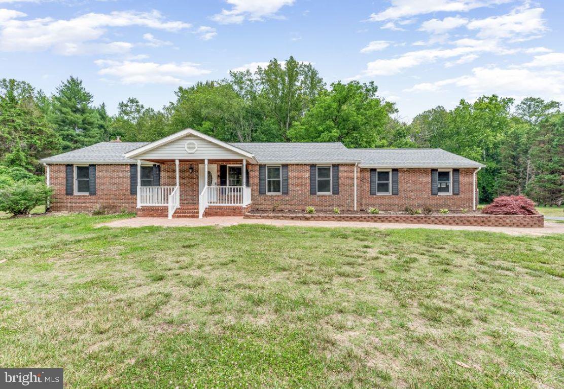 Beautiful Brick Rambler on 3 Acres. Spacious Living Room, Country Kitchen, Dining Room, Family Room with 3 Bedrooms.  Lower Level boasts Rec. Room with Brick Fire Place, pool table conveys , sitting room, storage area.  Enjoy eating hard crabs on the screened in porch.  Enjoy swimming in Inground pool (20x 40) .  Also a sheds for storing equipment.