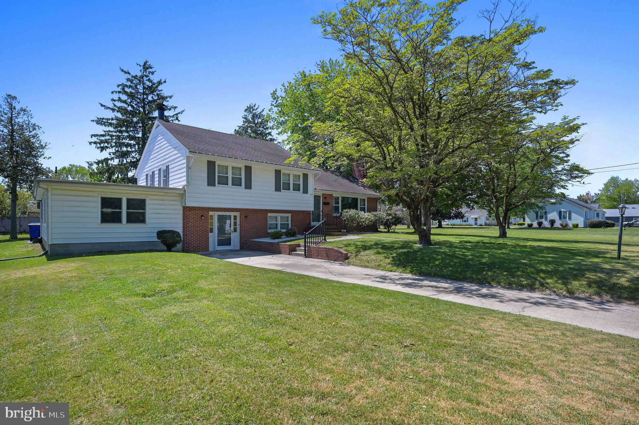 This 4-bedroom, 2-bath home in Harrington has a warm, welcoming feel from the moment you walk in. The family room is bright and inviting, with lots of windows letting in natural light and a cozy gas fireplace that makes it a great place to unwind. The main level features durable laminate vinyl plank flooring throughout, giving it a clean, modern look. 

The dining room stands out with its custom feature wall and a built-in buffet cabinet, perfect for everyday meals or hosting friends and family. The kitchen offers recessed lighting, double wall ovens, and a beautiful set of windows over the sink so you can enjoy views of the side and backyard while you cook. Just off the kitchen, you’ll find a huge screened-in porch that’s ideal for relaxing or entertaining, with plenty of space to spread out. 

Upstairs, there are three spacious bedrooms and a full bath. Downstairs, the very large primary suite feels like its own private retreat, complete with a second fireplace, built-in cabinets and shelving, and an updated bathroom with a walk-in shower. You’ll also find the laundry room on this level for added convenience.

Outside, the backyard offers a nice mix of open space and a few mature trees that give the property character. There’s also a driveway and attached garage.

If you’re looking for a home with space, charm, and great areas to relax or entertain, this one is definitely worth a look—come see it for yourself!
