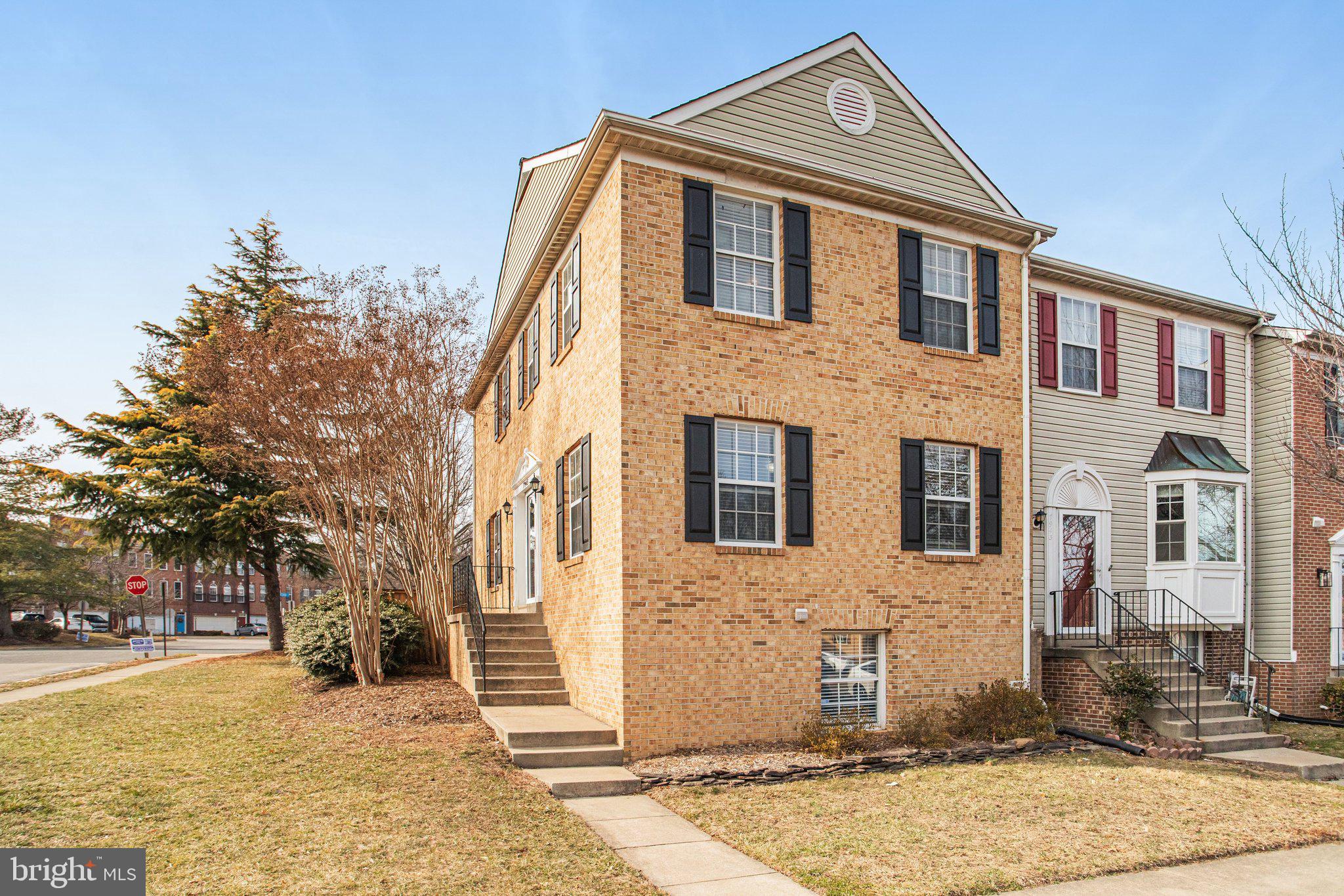 This beautiful brick, side-entry end-unit townhouse offers 3 bedrooms and 3.5 bathrooms in the desirable Gunston Square community. The three-level home is filled with natural light and features an open, functional layout with tasteful updates throughout. The main level offers wide-plank flooring and crown molding, with a spacious living and dining area that flows into the updated kitchen, renovated in 2020, with white cabinetry, quartz countertops, stainless steel appliances, and a center island. Upstairs features two generously sized bedrooms with ample closet space. The finished lower level includes a large recreation room with a wood-burning fireplace, a full bathroom, and flexible space ideal for a home office, guest area, or the 3rd Bedroom. Enjoy outdoor living with a large private deck and fully fenced yard. Major updates include a new roof in 2018 and interior flooring completed in 2020. Two assigned parking spaces. The community offers a pool, basketball court, and playground. Conveniently located near Fort Belvoir, I-95, VRE, shopping, dining, and parks. A move-in ready end-unit offering space, light, and location!