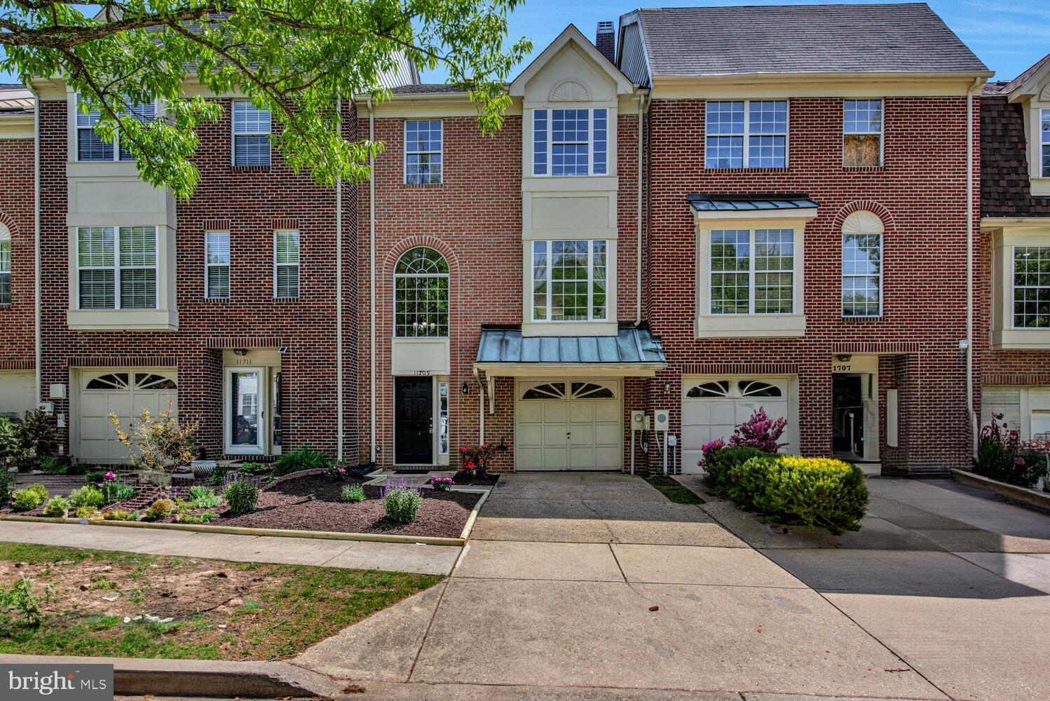 Welcome to this beautifully updated townhome in the sought-after Montpelier Hills community of Laurel!
From the moment you step inside, you’ll fall in love with the warmth of hardwood flooring throughout the entire home and the modern updates that make this property truly move-in ready!!

The entry level offers a spacious room with a full bathroom, large closet, and private outdoor access—perfect as a guest suite, home office, or potential fourth bedroom. Upstairs, the main level shines with an open and airy layout featuring a large and cozy family room with a charming wood-burning fireplace. The heart of the home is the updated kitchen with sleek stainless steel appliances and plenty of room to cook! Step outside from the kitchen OR the dining room onto a generous back deck—ideal for relaxing or entertaining. The upper level boasts three large bedrooms, all with vaulted ceilings. The primary suite is a true retreat, offering a luxurious ensuite bath with a jacuzzi tub, double vanity, and separate stand-up shower. An additional full bathroom in the hallway provides convenience and comfort for the secondary bedrooms. Enjoy the privacy of a fully fenced backyard and the flexibility of a front-loading garage currently set up as a game room—easily converted back to a garage if desired.

Don't miss your chance to own this spacious, well-maintained gem in a peaceful, tree-lined community with easy access to commuter routes, shopping, and dining!!

Homeowners Association Fee's include weekly trash & recycling pickup, basketball, tennis & volleyball courts, picnic pavilion and tot lot playground!!!

**30 min to Washington DC or Baltimore, less than 10 min from the Baltimore/Washington Parkway**
 ***Only 10 min to Fort George G. Meade base and only 25 minutes from Joint Base Andrews***