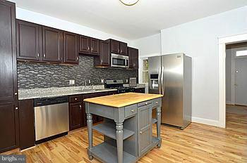 Home offers an array of upgds w/the main lvl consisting of a sep dining area & a matchless kitchen with stainless steel appliances and granite countertops. The lwr lvl is comprised of a   bath & rec room that is great for entertaining or raising a family.  Includes washer-dryer and a host of other upgrades. Centrally located to Clifton Park and public transportation. YOU WILL NOT BE DISSAPOINTED!