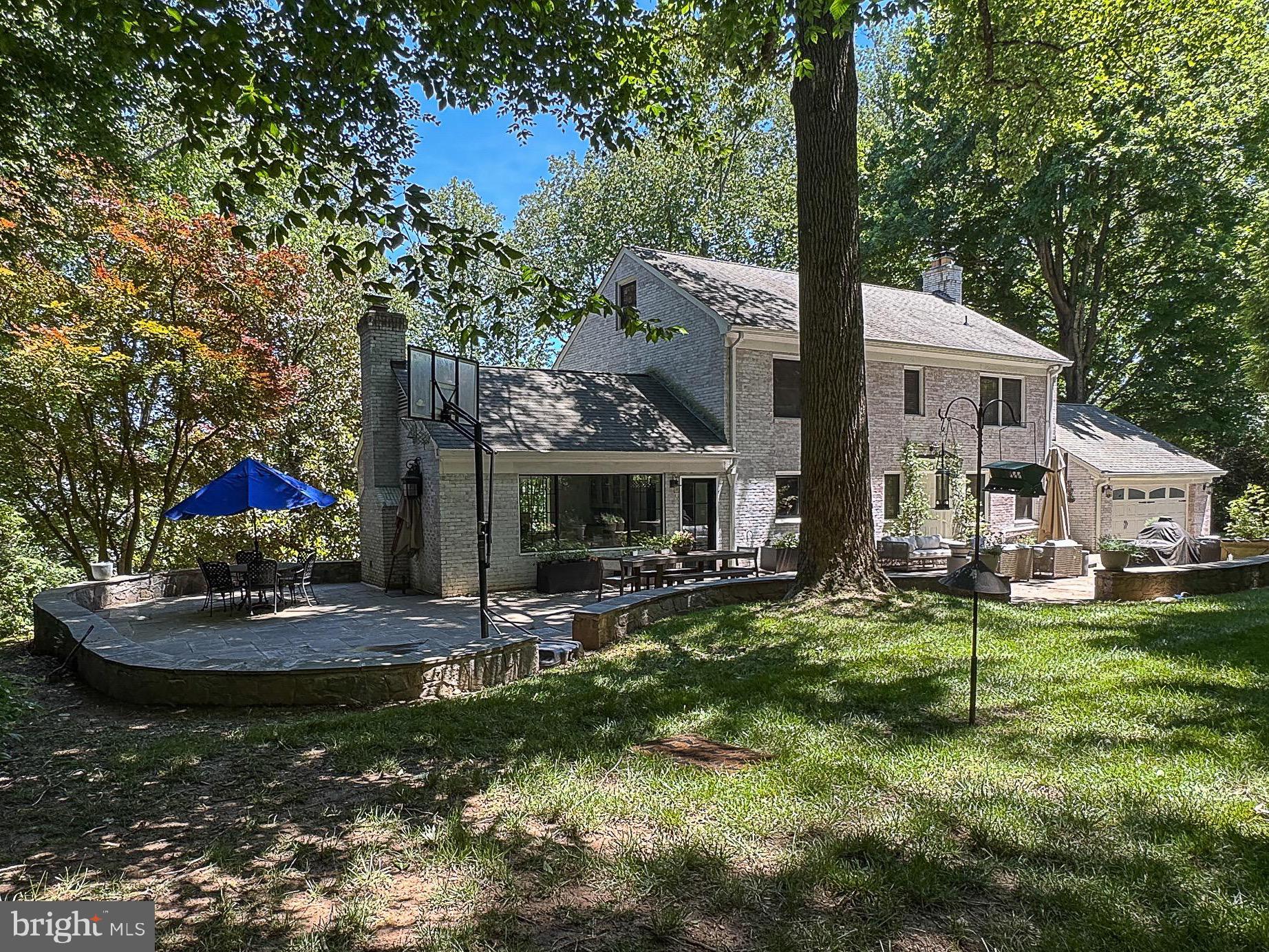 OPEN HOUSE SUNDAY, JUNE 7, 1:00-3:00.  Updated modern finishes with the warm charm of timeless quality and all-brick construction.  Desirable Langley, Cooper school pyramid with  .83-acre cul-de-sac lot in the highly sought-after Eagle Rock neighborhood.  For outdoor enthusiasts, just moments from the Langley Swim and Tennis Club (Membership can convey!) and adjacent to Scott's Run Park, immediate access to Trails.  A stunningly renovated and expanded kitchen, a true showstopper designed by Unique Kitchens and Baths in 2022 as featured in HGTV Magazine. With quartz countertops, a JennAir refrigerator, and an upscale Ilve induction range with a double oven, this space is as functional as it is beautiful. . The thoughtfully updated bathrooms,  hardwood floors, and custom-built ins throughout. Newer double-hung windows and numerous other updates and improvements, over $300K just within the past 5 years.
Updated family room just off the kitchen outfitted with built-ins, wood fireplace and a wet bar with Sub Zero beverage fridge with direct access to the stone patio.  Perfect for entertaining large crowds or family dinners.  Formal living and dining room combination with a second wood-burning fireplace.

The expanded primary suite, complete with an updated and expanded luxurious en-suite bathroom, spacious walk-in closet.  Two more spacious bedrooms complete this level along with another updated bath.  Secret room off the nursery bedroom for a bonus playroom.   The versatile fourth level  currently serving as an office/bedroom with a spacious walk-in closet.
The finished walkout lower level, featuring a gym, an additional bedroom, and a full bath—ideal as a private suite for an au pair or visitors. Outside, the oversized stone paver patio, charming stacked stone walls, and thoughtfully designed walkways create an inviting setting for outdoor gatherings, surrounded by mature trees and lush landscaping.  Updates: Kitchen 2022, both chimneys revamped/improved (2019),  Basement renovation (2020), windows (2015) primary and secondary baths, family room bar and built-ins (2022) and so much more. Newer Invisible Fence.
Located on a cul-de-sac street filled with unique homes, this property offers the perfect balance of tranquility and accessibility. With easy access to Georgetown Pike, I-495, Tysons, and Washington, D.C.