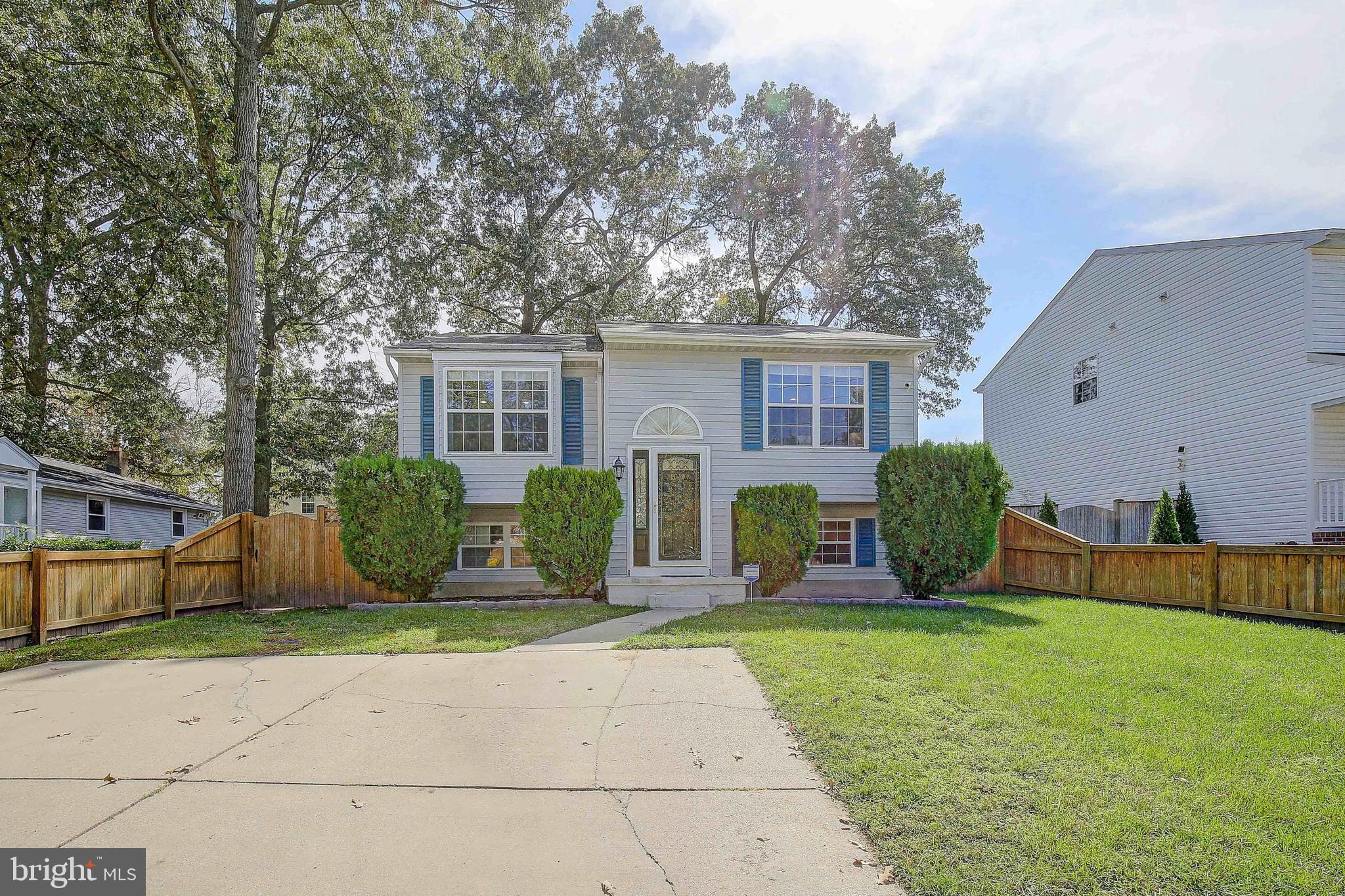 Multiple Offers Received.  Offer deadline 4:30PM Sunday.  Welcome to this meticulously maintained split foyer home on an idyllic street. The first thing you will notice is the curb appeal of this home. Upon entry you will find beautiful hardwood floors and fresh carpet throughout.  The upper level features a large eat in kitchen with recently upgraded countertops.  The living room is flooded with natural light.  There are three large bedrooms upstairs.  The owner’s suite features an en suite bath, and custom closets.  Just off the owner’s suite, you will find a large sunroom which makes the perfect relaxation space.  The lower level has an additional bedroom, a full bathroom, a large rec room and 5th bonus room which makes the perfect flex space.  The basement walks out to a full fenced back yard.  This home features loads of living space and a perfect yard for outdoor entertaining.