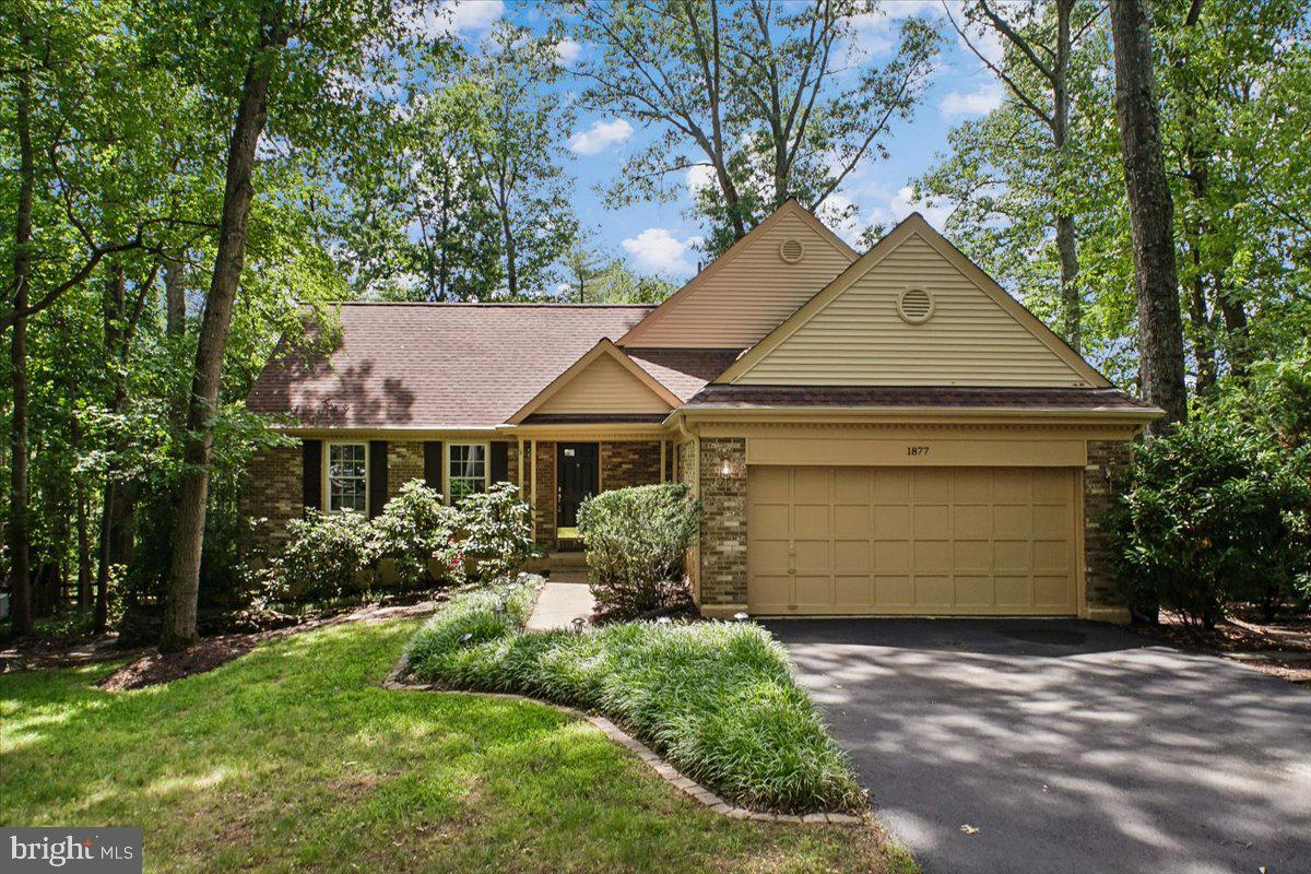 FROM ITS PEACEFUL NATURAL SETTING TO ITS THOUGHTFULLY DESIGNED LIVING SPACES, THIS BEAUTIFULLY MAINTAINED RESTON HOME IS READY TO IMPRESS. SITUATED ON .36 ACRES AND SURROUNDED BY MATURE TREES, IT OFFERS A WONDERFUL CONNECTION TO THE OUTDOORS WHILE REMAINING CLOSE TO EVERYTHING RESTON HAS TO OFFER.  STEP INSIDE WHERE HARDWOOD FLOORS WELCOME YOU AND FLOW THROUGHOUT THE EXPANSIVE LIVING ROOM, ACCENTED BY CROWN MOLDING AND FILLED WITH NATURAL LIGHT. THE LIVING ROOM OPENS TO THE FORMAL DINING ROOM, WHERE CUSTOM BUILT-IN CABINETRY PROVIDES THE PERFECT SPACE FOR STORING AND DISPLAYING YOUR ENTERTAINING ESSENTIALS.  JUST BEYOND, THE KITCHEN FEATURES HARDWOOD FLOORS, UPGRADED COUNTERTOPS, STAINLESS STEEL APPLIANCES, AND A BUILT-IN DISPLAY CABINET THAT ADDS BOTH CHARM AND FUNCTIONALITY. THE TRUE SHOWSTOPPER OF THIS LEVEL IS THE INCREDIBLE SUNROOM ADDITION. FLOODED WITH NATURAL LIGHT FROM A WALL OF WINDOWS AND TWO SKYLIGHTS, THIS VERSATILE SPACE OFFERS THE PERFECT SETTING FOR CASUAL DINING, MORNING COFFEE, OR SIMPLY RELAXING WHILE ENJOYING VIEWS OF THE BEAUTIFULLY LANDSCAPED, FENCED REAR YARD. DIRECT ACCESS TO THE DECK CREATES A SEAMLESS INDOOR-OUTDOOR LIVING EXPERIENCE.  JUST A FEW STEPS DOWN, THE WARM AND INVITING FAMILY ROOM FEATURES HARDWOOD FLOORS AND A BRICK SURROUND WOOD-BURNING FIREPLACE, CREATING THE PERFECT SPACE FOR MOVIE NIGHTS, GAME DAYS, OR QUIET EVENINGS BY THE FIRE. THIS LEVEL ALSO OFFERS A GENEROUSLY SIZED BEDROOM AND A FULL BATH WITH TILE FLOORS AND A TUB/SHOWER COMBINATION, MAKING IT IDEAL FOR GUESTS OR MULTI-GENERATIONAL LIVING. FROM HERE, STEP OUT TO A SECOND CUSTOM DECK AREA AND ENJOY THE TRANQUIL OUTDOOR SETTING.  THE LOWER LEVEL PROVIDES EVEN MORE FLEXIBLE LIVING SPACE WITH A LARGE REC ROOM FEATURING NEUTRAL CARPETING AND RECESSED LIGHTING. YOU WILL ALSO FIND A LAUNDRY ROOM WITH A SIDE-BY-SIDE FRONT-LOADING WASHER AND DRYER, ALONG WITH ABUNDANT STORAGE SPACE AND BUILT-IN SHELVING.  UPSTAIRS, HARDWOOD FLOORS CONTINUE INTO THE PRIMARY SUITE, WHICH FEATURES A WALK-IN CLOSET, SEPARATE DRESSING AREA, AND A BEAUTIFULLY RENOVATED EN SUITE BATH WITH TILE FLOORS, AN UPGRADED VANITY, AND A STAND-ALONE SHOWER WITH CUSTOM TILE AND A FRAMELESS GLASS DOOR.  AN ADDITIONAL BEDROOM WITH HARDWOOD FLOORS AND DECORATIVE WAINSCOTING, ALONG WITH A RENOVATED FULL BATH FEATURING TILE FLOORS, A VANITY, AND A TUB/SHOWER COMBINATION, COMPLETE THIS LEVEL.  ON THE TOP FLOOR, YOU WILL FIND A PRIVATE FOURTH BEDROOM RETREAT WITH A VAULTED CEILING, OFFERING THE PERFECT SPACE FOR GUESTS, A HOME OFFICE, HOBBY ROOM, OR A QUIET ESCAPE.  ALL OF THIS IS CONVENIENTLY LOCATED NEAR RESTON'S EXTENSIVE TRAIL SYSTEM, PARKS, SHOPPING, DINING, MAJOR COMMUTER ROUTES, AND METRO ACCESS. COMBINING VERSATILE LIVING SPACES, A BEAUTIFUL NATURAL SETTING, AND AN UNBEATABLE LOCATION, THIS IS A HOME YOU WILL NOT WANT TO MISS. APPROX. DATES FOR ROOF 2024 & HOT WATER HEATER 2010.