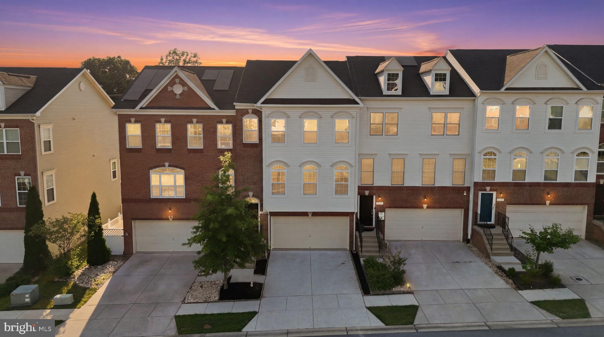 Welcome to 8597 Crooked Tree Lane, where timeless elegance, thoughtful renovations, and an exceptional location converge in the highly sought-after Fieldstone community of Laurel. This beautifully appointed residence makes an unforgettable first impression with its stately brick water table façade, lush professional landscaping, elevated front entry, two-car garage, two-car driveway, and additional parking conveniently located directly in front of the home. Step inside to an inviting foyer adorned with hardwood flooring that flows into a sun-drenched open floor plan where three dramatic Palladian windows flood the expansive family room with natural light, creating an atmosphere of warmth and sophistication. Freshly painted throughout and complemented by brand-new carpet, recessed lighting, and generously proportioned living spaces, every detail has been thoughtfully refreshed. The gourmet chef's kitchen is designed for both everyday living and effortless entertaining, showcasing 42-inch snow-white cabinetry, gleaming granite countertops, stainless steel appliances, a gas-powered range, center island, oversized pantry, and seamless flow into the dining area highlighted by elegant pendant lighting. Just beyond, step onto your private deck—the perfect setting to enjoy your morning coffee, dine al fresco, or unwind while overlooking peaceful surroundings. A beautifully appointed powder room completes the main level. Upstairs, retreat to an extraordinary owner's suite featuring soaring cathedral ceilings, recessed lighting with customizable dimmable color selection, spacious walk-in closets, and a spectacular 2024 designer-renovated spa bathroom worthy of a luxury magazine. Indulge in the breathtaking wet room finished with floor-to-ceiling porcelain tile, matching tiled shower floor and niche, frameless glass enclosure, premium independent rain shower and hand shower system, an oversized soaking tub with wand, custom quartz-topped double vanity, and exquisite designer finishes throughout. Two spacious secondary bedrooms, a full bath with dual vanities, ceramic tile flooring, linen closet, and a convenient upper-level laundry room complete the bedroom level. The finished walkout lower level expands your living space with brand-new paint, brand-new carpet, recessed lighting, a full bathroom, direct garage access, and endless flexibility for a recreation room, guest suite, fitness studio, or home office. The finished two-car garage features durable epoxy flooring, providing both style and functionality. Extensive 2024 improvements include the luxurious owner's bath renovation, finished garage, designer LED recessed lighting with dimmers and color selection in the living room and owner's suite, brand-new paint throughout, and brand-new carpeting, allowing for truly turnkey living. Beyond the home, Fieldstone offers an exceptional lifestyle with resort-style amenities including two community pools with a dedicated kiddie pool, clubhouse, multiple playgrounds, tot lots, scenic walking trails, and beautifully maintained green spaces. Ideally positioned just minutes from shopping, grocery stores, restaurants, Maple Lawn, Arundel Mills, Columbia, and major commuter routes including I-95, Route 32, Route 295, and Route 29, with effortless access to the National Security Agency, Fort Meade, Johns Hopkins Applied Physics Laboratory, Baltimore/Washington International Thurgood Marshall Airport, Baltimore, and Washington, this remarkable residence offers the perfect balance of luxury, convenience, and everyday comfort in one of Laurel's most desirable communities.