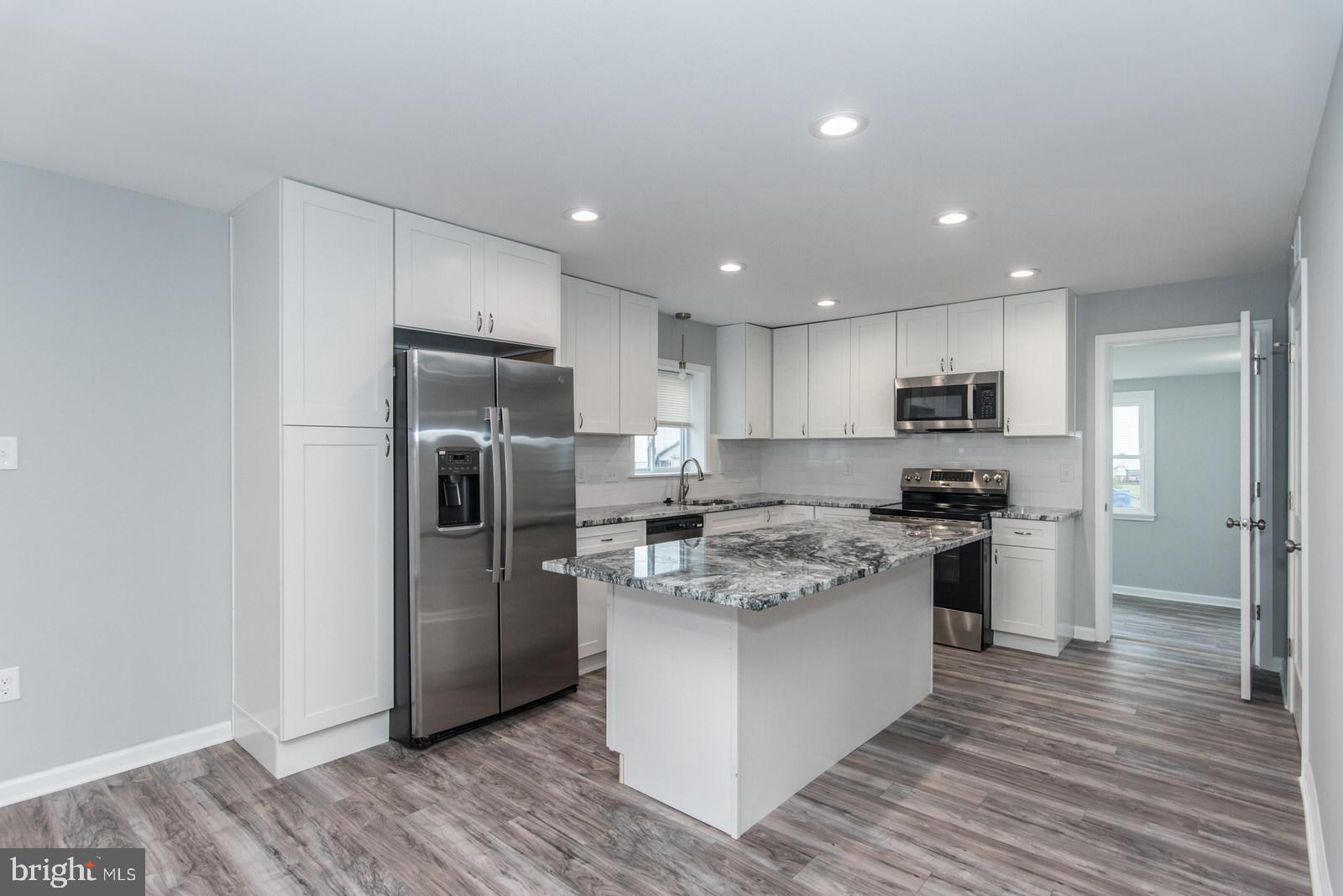 Lucky for you. Previous buyers financing fell through. This is your opportunity to LOOK NO FURTHER!!! Here is your opportunity to purchase a completely updated end unit 3BR, 1.5 Bath townhome with a fenced in yard, off-street parking, shed and wrap around deck that is great for entertaining. The low taxes make this home great for investors looking for an income producing property or for buyers looking for a home to fit their budget in the Bucks County area.  First floor features new laminate flooring and fresh paint throughout living/dining area with large casement windows for lots of natural lighting. The newly updated kitchen features new white shaker cabinets, granite countertops, subway backsplash, and new stainless-steel appliances. There is a ½ bath off the kitchen along with a Laundry/mechanics room that has washer/dryer hookup. Off the kitchen at the back of the house there is a freshly painted sunroom with large windows that allow natural lighting and is great for relaxing or making a playroom. On the 2nd floor you will find 3 great-sized bedrooms with ceiling fans and a newly renovated hall bathroom. The Exterior features new vinyl siding, shingles, and flat roof. This home is conveniently situated near major roads, (I-95 and PA/NJ turnpikes) local highways, NJ bridges, train stations, schools and shopping. This is the perfect home for your rental portfolio or to call home. Make your appointment today and call it home tomorrow!