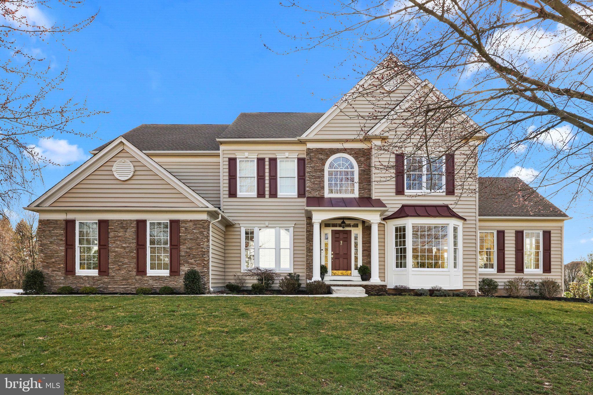 Welcome to 38 Eagleton Farms Rd, a stunning home nestled on a peaceful parcel offering quiet country views. Recently upgraded with fresh stacked stone and siding, the exterior sets the stage for the beauty that lies within. Step inside to discover a thoughtfully designed floor plan, featuring a full bath and a 5th bedroom on the first floor. The tucked away large bonus room complete with deck, provides a perfect retreat, separate from the central hub of the house. This kitchen boasts an expansive island with a stunning stone countertop. The Thermador commercial range and custom hood, gorgeous wood cabinets with hideway storage and glass front uppers, wood paneled dishwasher and walk-in pantry makes this kitchen a chef's dream. Enjoy meals in the kitchen's spacious dining area or step outside to the covered composite deck for alfresco dining with a view. The connected family room offers easy TV watching in a cozy atmosphere with its stacked stone wood burning  fireplace, while the stylish dining room sets the tone for elegant entertaining. The first floor bedroom and renovated full bath are ideal for guests or convenient first-floor living. Upstairs, the primary bedroom is a luxurious retreat with a beautifully updated bath featuring a shower, vanities, tub, and a large walk-in closet, all designed with timeless elegance. A bonus office space off the primary bedroom adds convenience and charm. The second bedroom boasts a private ensuite, while bedrooms 3 & 4 are generously sized and share a large renovated bathroom. One of the home's standout features is its huge high ceiling walk-out basement, a rare find that offers endless possibilities for expansion. With plumbing for a bathroom and new french doors leading to the vast open space of the parcel, this basement is ready to be transformed into additional living space. Located just minutes from downtown Newtown, this home offers easy access to great eateries, shops, and the sought-after Council Rock North Schools. Experience the beauty and convenience of Bucks County living at its finest!