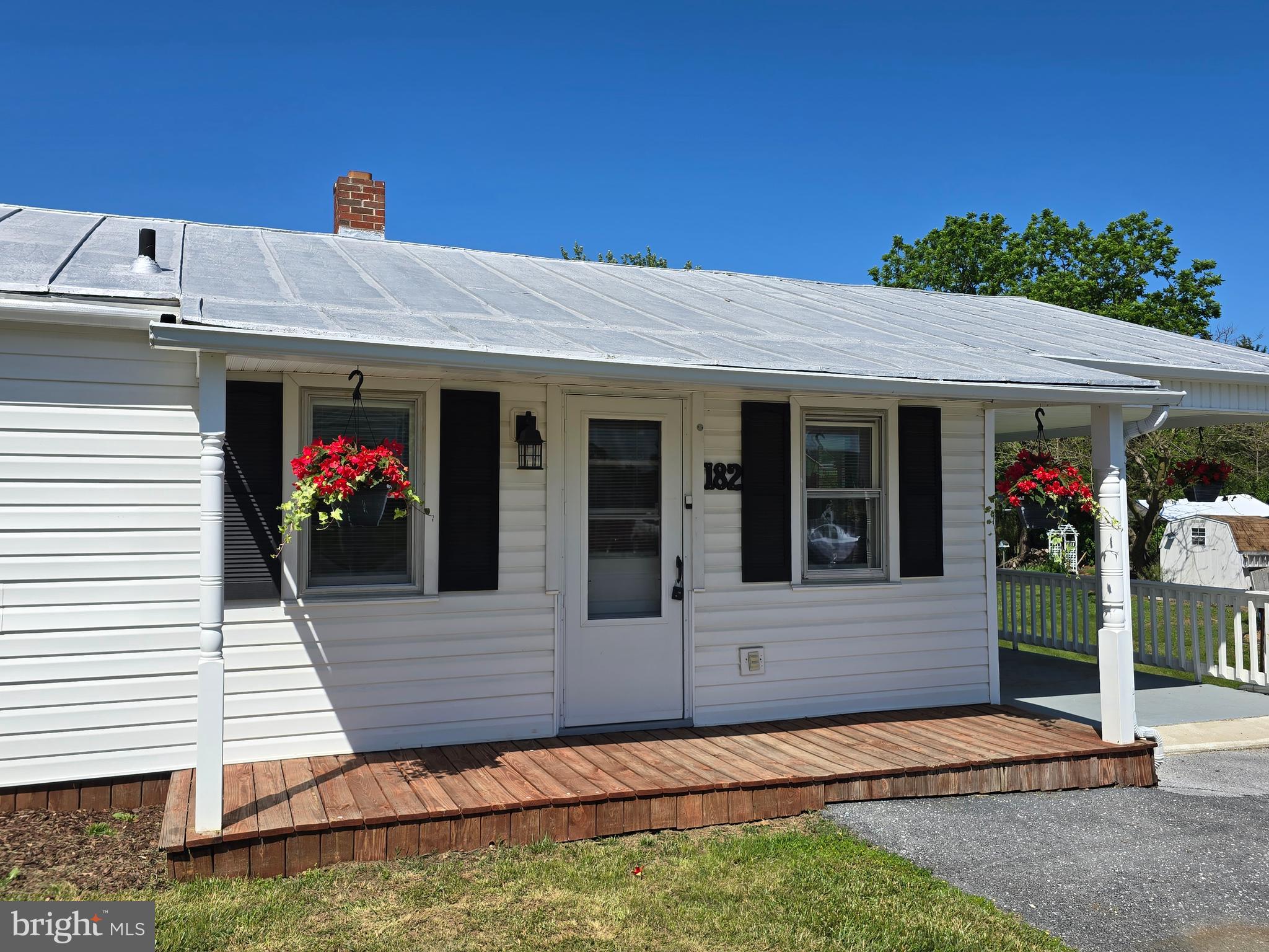 Discover the charm of this beautifully renovated ranch-style home, nestled in the Town of Mount Jackson. With a major renovation completed in 2017, this residence boasts a perfect blend of modern comfort and classic appeal. The exterior features durable vinyl siding and is complemented by street lights that enhance the neighborhood's inviting atmosphere. Step inside to find a well-designed layout featuring three spacious bedrooms and two full bathrooms. The heart of the home is the bright and airy living space, where hardwood and carpet flooring create a warm ambiance. The kitchen is equipped with appliances, including a self-cleaning electric oven, refrigerator, custom cubbies, large pantry, and eat-in table space. Off the larger bedroom, you will find a convenient stacked washer/dryer unit, making daily chores a breeze. The property sits on a generous 0.22-acre lot, offering a level yard perfect for outdoor activities. Enjoy serene views of the garden and lawn, providing a peaceful retreat right at your doorstep. The attached carport and additional driveway space ensure ample parking for you and your guests. This home is not just a place to live; it's a lifestyle choice that combines comfort, convenience, and community. Don't miss the opportunity to make this exceptional property your own—schedule a viewing today and envision the possibilities!

Home sold “as-is.” Original baseboard registers are still in place but not connected.