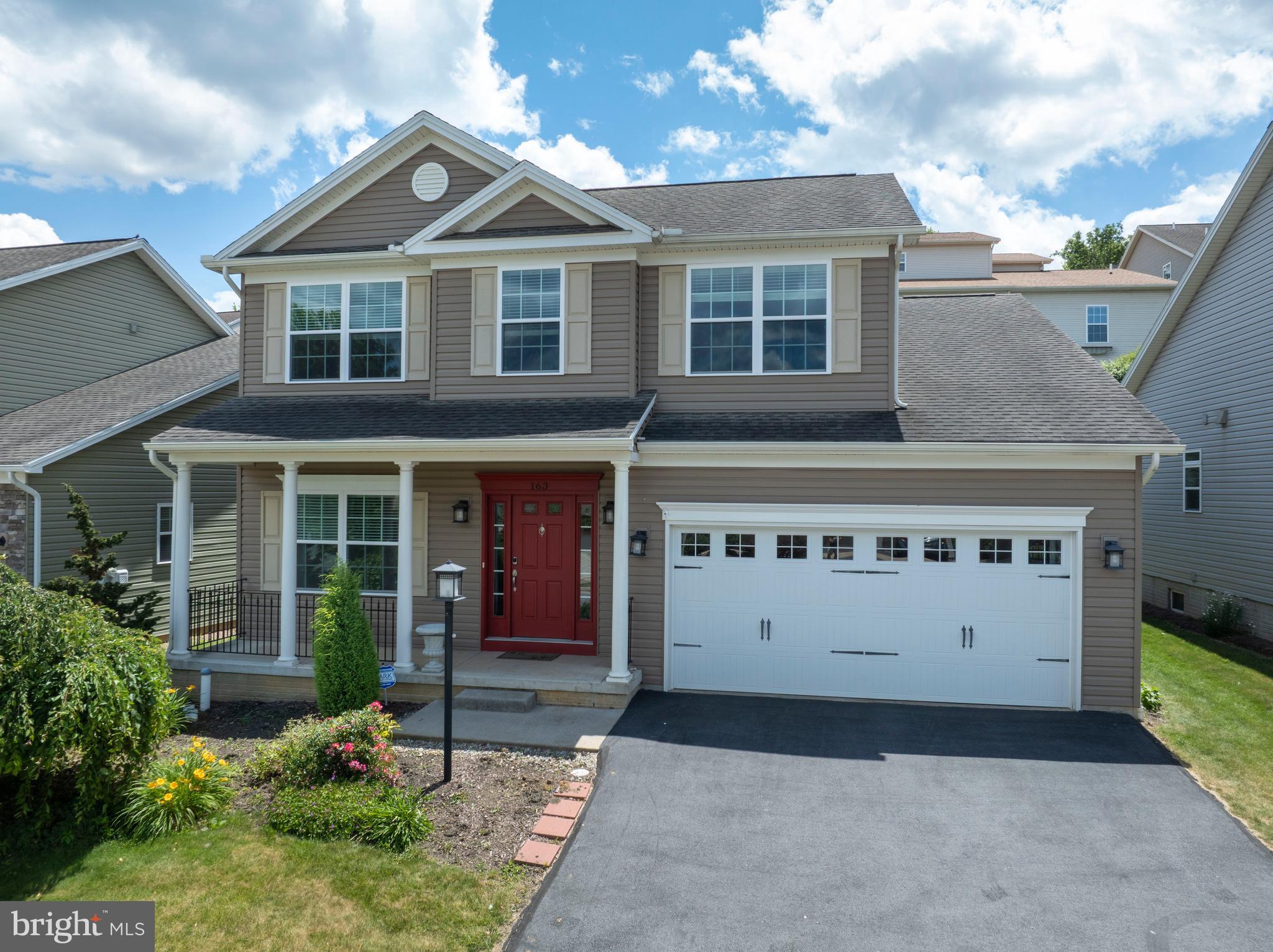 Welcome to this stunning two-story home in Tradition Point, offering the perfect blend of elegance, comfort, and functionality. This beautiful home features 4 bedrooms, including a convenient main-level owner's suite, 3 full baths and 1 half bath. Rich hardwood flooring flows throughout the main level adding warmth and timeless character. The kitchen is designed for both everyday living and entertaining, featuring stainless steel appliances, gorgeous quartz countertops, a pantry, and plenty of workspace and cabinet space. The adjoining living room is filled with natural light and centered around a cozy fireplace, creating the perfect gathering space. The main-level owner's suite offers a private retreat with a spacious primary bedroom and a luxurious fall bath complete with double vanity, walk-in shower, soaking tub with beautiful tile surround and tile flooring.  The main level also offers an office, laundry room and half bath. Upstairs, you'll find two additional bedrooms, a full bath with tile flooring and a charming nook that would make a perfect office, reading space, or study area. Don't miss the incredible finished lower-level featuring durable LVP flooring throughout. This area is ideal for entertaining with a wet bar, granite countertops, a built-in wine rack, a built-in granite table, and a fireplace. An additional bedroom and full bath on the lower level provide excellent guest accommodations or flexible living space. There is also an abundance of storage throughout the home. This exceptional property combines stylish finishes, spacious living areas, and thoughtful details in Tradition Point's desirable location, close to the stadium, shopping and restaurants. Take advantage of the club house just around the corner with tons of added amenities including a weight room, meeting area and the gorgeous inground pool. You won't want to miss this one! Showings start 6/24 and there will be an open house on Thursday, 6/25, 4:30-6:30pm.
