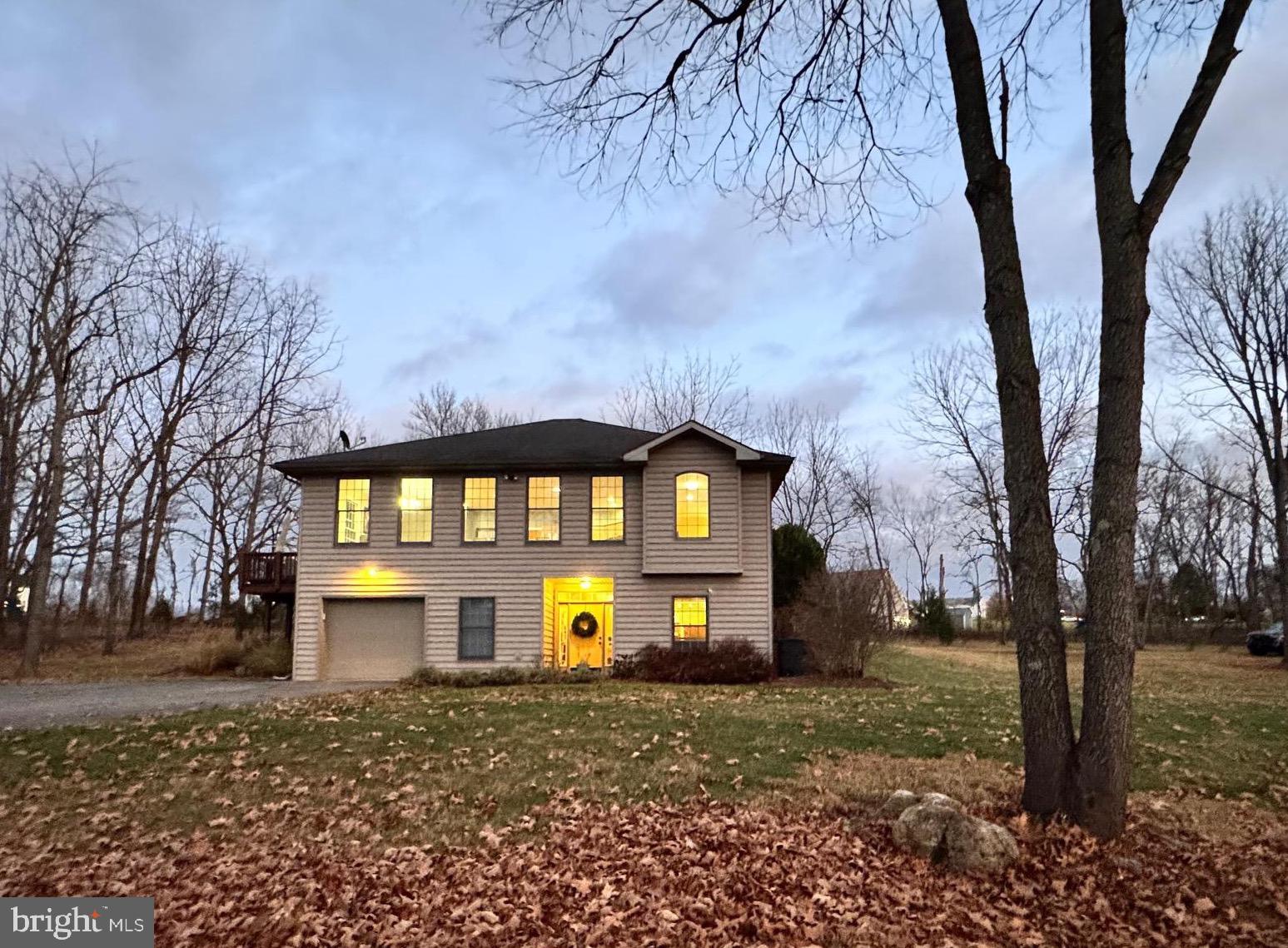 Welcome to your 6 ACRE park-like retreat!  232 Southpaw Lane is tucked away just 2 miles from downtown Shepherdstown on a quiet street with only one other home!  This hidden gem is surrounded by mature trees and nearly invisible during the summer months.  The home was custom built by the late DL Lewis Construction.  Upon entering you will be welcomed by a large foyer, storage space and sizable flex room currently used as a multimedia area and gym.   A raised main level offers the living, kitchen, three bedrooms and two bathrooms on the second floor. The substantial second floor living area is flanked by vast windows spanning the length of the room.  The open floor plan is further accentuated by the tall ceilings and flowing maple hardwood floors.  The kitchen boasts granite countertops, endless cabinets, stainless steel appliances and an oversized pantry.  Snuggle in next to the gas fireplace in the family room which is flanked by nearly  floor to ceiling built-in bookcases.  The primary bedroom has an en suite bathroom, walk-in closet,  linen closet, and a laundry shoot that deposits laundry directly from the primary bedroom to the laundry area below!   Immerse yourself in nature while tucked away on the heavily wooded lot on your outdoor deck or stone patio.  Internet service is provided by Comcast/Xfinity.  Improvements include a new heat pump (less than 5 years old), reverse osmosis, UV light and iron filter water system, and a dual heat system with propane gas backup.  There is so much to love about this 3 bedroom, 2 bath home on 6 acres so close to downtown Shepherdstown.  Downtown Shepherdstown hosts an array of dining and shopping options and Shepherd University. Also just a few miles away is the 184.5 mile C&O Towpath, which stretches from Georgetown to Cumberland along with Cress Creek Golf and Country Club with its 112 acre rolling terrain golf course and options of social, golf, tennis and pool memberships. In addition to its proximity to downtown Shepherdstown this property is conveniently located near Sharpsburg, Martinsburg, Charles Town and Harpers Ferry and is a reasonable commute to neighboring Maryland and Virginia. Due diligence for feasibility of intended use; measurements and listing information are based on available tax and public records.