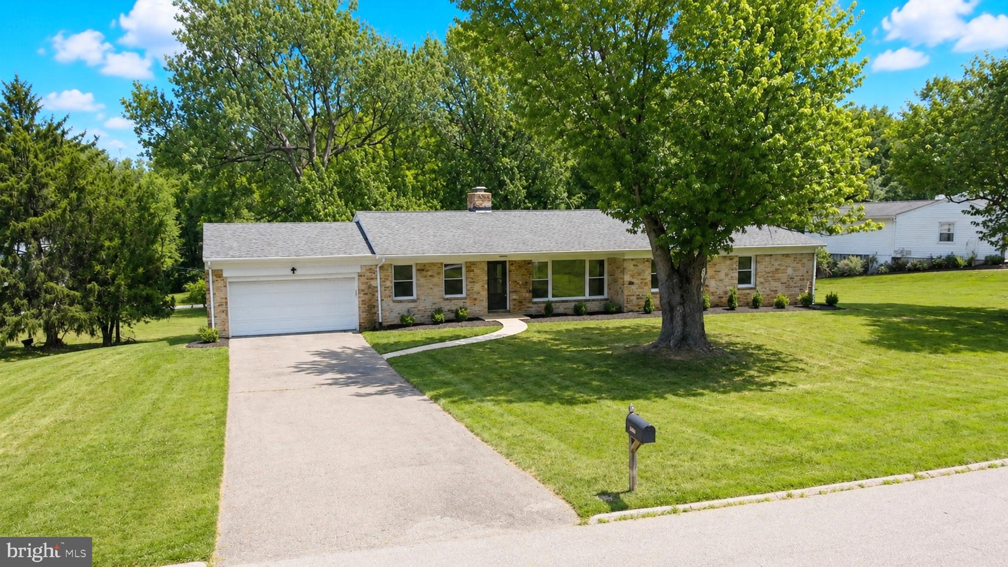 Beautifully renovated rancher in the Hampton area offering 4 bedrooms, 3 full baths, and approximately 4,006 estimated total square feet across two finished levels. Renovated in 2026, this stone-front home features a bright, open layout with modern finishes, updated flooring, recessed lighting, and thoughtfully designed living spaces throughout.

The main level offers comfortable one-level living with three bedrooms and two full baths, along with spacious living and dining areas filled with natural light. The renovated kitchen features warm wood cabinetry, upgraded countertops, stainless steel appliances, a center island with seating, modern lighting, and excellent prep and storage space. The adjoining living area includes a sleek fireplace feature wall and large windows overlooking the front lawn.

The primary suite includes an updated bath with double vanity, walk-in shower, modern tile, and stylish finishes. Two additional main-level bedrooms and a second full bath provide flexible space for guests, work, or everyday living.

The finished lower level expands the home with a large recreation area, fourth bedroom, full bath, wet bar area with beverage refrigerator, additional storage, and access to the attached 2-car garage.

Exterior highlights include a long driveway, front-entry garage, patio area, mature trees, and a generous 0.81-acre lot. A beautifully updated rancher offering modern style, flexible living space, and inviting indoor-outdoor living.