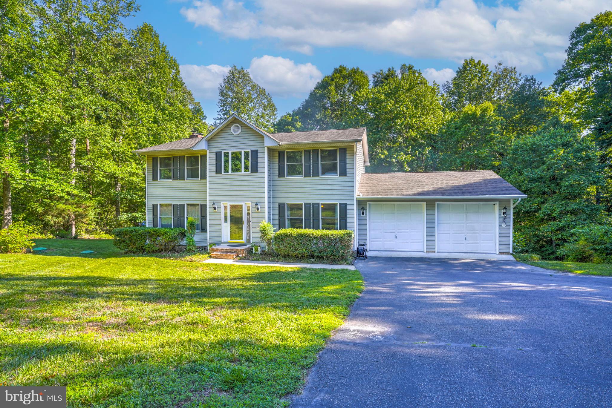 Located in the desirable Esperanza Farms waterfront community on the Patuxent River, this 4-bedroom, 2.5-bath colonial sits on a private 1.04-acre lot surrounded by trees and peaceful backyard views.

This 2-level home features hardwood floors, a wood-burning fireplace, and a large kitchen with an island and plenty of cabinet space.

Extra parking and an oversized 2-car garage finished with new insulation and custom flooring. Large walk-in crawl space offers great storage.

Outside, enjoy the large deck, new patio with a built-in fire pit, and a quiet backyard that backs to the woods. New 50-gallon water heater.

The backyard's natural slope has been improved with a French drain system to manage water runoff and proper drainage throughout the property. Helping direct water away from the home. 

No HOA! Residents of Esperanza Farms enjoy water access to the Patuxent River, perfect for launching a kayak, swimming, fishing, or crabbing while enjoying the Chesapeake lifestyle right in the neighborhood. Conveniently located close to schools, shopping, and PAX River.
