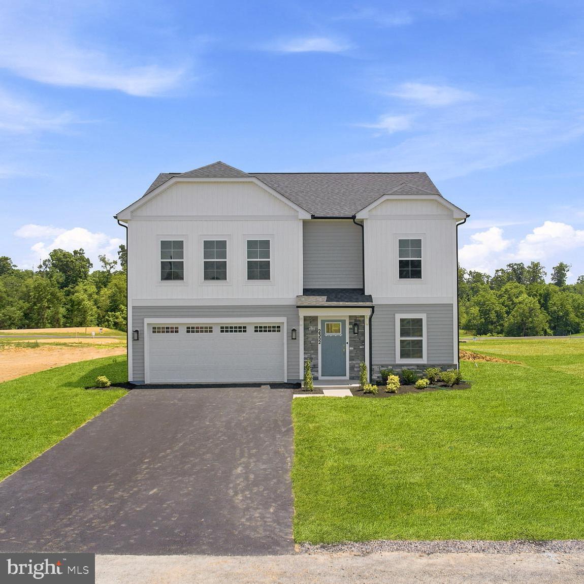 Move In Ready! If you want a brand-new home in Chambersburg without waiting months for construction, this home is ready to move in! This Carnegie II offers over 2,500 sq. Ft. of living space designed with you in mind, including a 4ft rear extension that makes the kitchen, family room, and upstairs bedrooms feel even more spacious.  You’ll enjoy a bright kitchen with white cabinets, quartz countertops, crown molding, a stainless-steel apron front sink, and a GE French door refrigerator. Luxury vinyl plank flooring covers the main level, while the second floor features plush upgraded carpet and tiled bathrooms. The exterior blends vinyl siding with stone accents, and the .27 acre homesite comes fully sodded! Located in peaceful Franklin County, PA, Spring View Farms offers rolling hill views, a quiet Chambersburg setting, and even HOA approved chicken coops for a touch of homesteading. This home delivers the upgrades, space, and convenience of a new build without the wait. Schedule your tour today.