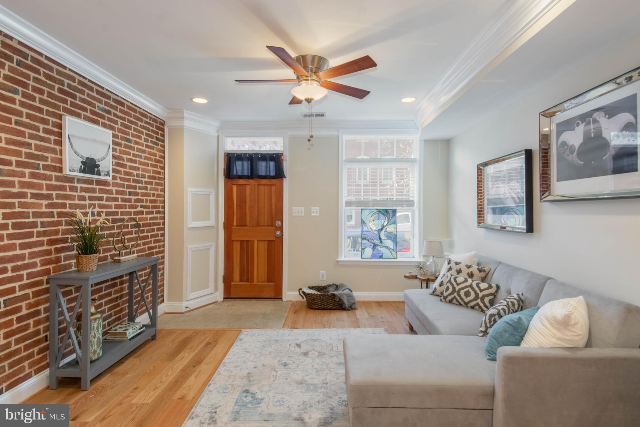 PRICE IMPROVEMENT!  PICTURE PERFECT FELLS POINT ROWHOME WITH OVER 1,700 SQ. FT. OF LIVING SPACE & ROOFTOP DECK!  Open floor plan featuring a spacious living room w/ exposed brick, hardwoods,gourmet Chef's kitchen w/ granite counters, ss appliances, and tons of cabinet space, separate dining area, main level half bath, 2nd level w/ 2 bedrooms. One of the two baths on this level features is at home spa with a whirlpool tub.   The rear bedroom has it's own  covered  deck! Bedroom level laundry, dual zoned AC/heat, 3rd level Primary suite w/ a generously sized bedroom   &  a bonus room which leads to the expansive rooftop  deck with incredible city views!  Located steps from Fells Point shopping and restaurants & convenient to Patterson Park, waterfront, and Harbor East!