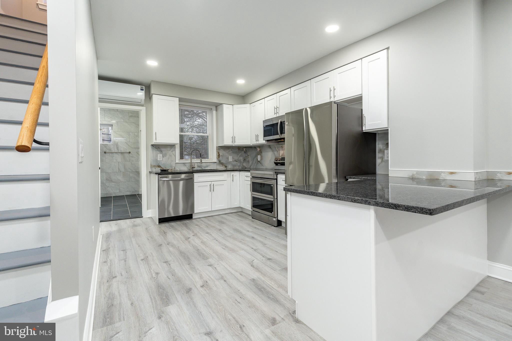 Welcome to 5208 Glenloch St! This fully renovated 2-bedroom, 2.5-bath home has been thoughtfully updated from top to bottom. The first floor features brand-new shaker cabinets, granite countertops, stainless steel appliances, and an open-concept layout with a stylish breakfast bar—perfect for everyday living and entertaining. Also on the main level is a full bathroom showcasing large-format tile and sleek matte black finishes.

New waterproof vinyl flooring runs throughout the home. Upstairs, you’ll find two spacious bedrooms with excellent closet space and a beautifully finished full bathroom highlighted by elegant gold fixtures. The partially finished basement provides additional living space and includes a convenient half bath.

Step outside to a large backyard, ideal for grilling, relaxing, or accommodating pets. Additional upgrades include a brand-new electrical system, new plumbing, and new heating and cooling systems. This home is truly turnkey and ready for its next owner!