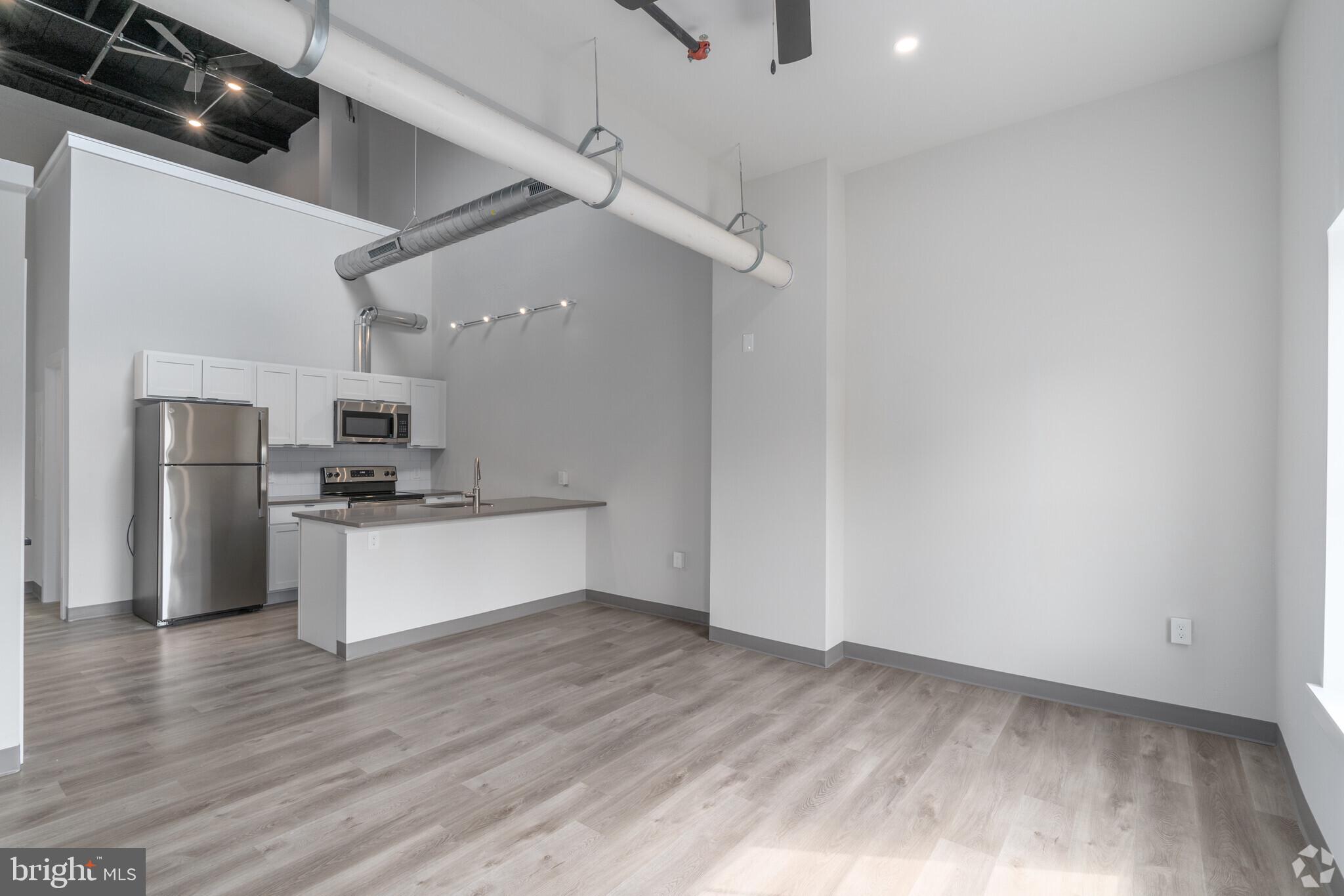 This new property is in the center of town, but two blocks removed from the busyness of Bridge Street. Onsite parking is available and these units are brand new. This former commercial building underwent a full conversion to apartments in 2022-2023 and was transformed into Phoenixville's newest boutique apartment building.

Unique setup in that every unit has its own exterior access either at grade level or from the catwalk. There are no shared hallways to walk through. The upper level units have dramatic high ceilings with loft storage space available as well.

(1 dog or 1 cat allowed, subject to a pet interview, breed restrictions, weight restrictions, additional upfront fee is not a deposit but a pet fee.)

All units have brand new and modern finishes, 4 piece kitchen appliance package, Quartz countertops, air conditioning, washer/dryers in the unit, Smart features, fire alarm, sprinkler systems and high ceilings. There is parking available for an additional monthly fee of $55. Don't pay for amenities elsewhere that you can't or won't use and come make this your new home in Phoenixville!