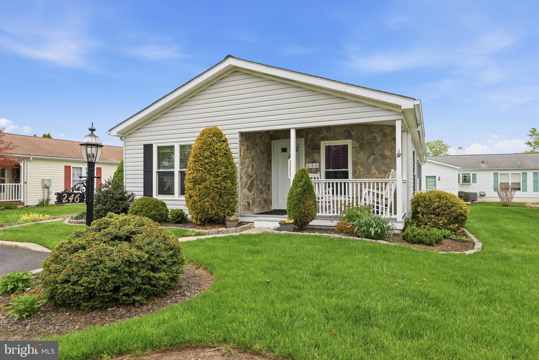 246 Thrush Circle offers easy living in the highly desirable Village of Buckingham Springs 55+ community in New Hope. From the moment you arrive, the well-kept landscaping, covered front porch, and inviting curb appeal make this home feel warm and welcoming. Inside, the layout is bright, open, and comfortable with natural light flowing through the main living spaces. The spacious living room connects easily to the dining area and kitchen, creating a layout that works well for both everyday living and casual gatherings. The kitchen features  cabinet space, a breakfast bar, and a dining area with views of the surrounding neighborhood. The primary suite offers a large bedroom, double vanity bath, and plenty of closet space. Additional rooms provide flexibility for guests, hobbies, or a home office. A separate laundry area and convenient one-floor living make day-to-day life simple and comfortable. Outside, enjoy quiet mornings on the covered porch or relaxing evenings on the patio. Located just minutes from downtown New Hope, Doylestown, shopping, dining, and major routes, this home offers a peaceful community setting with everything close by.