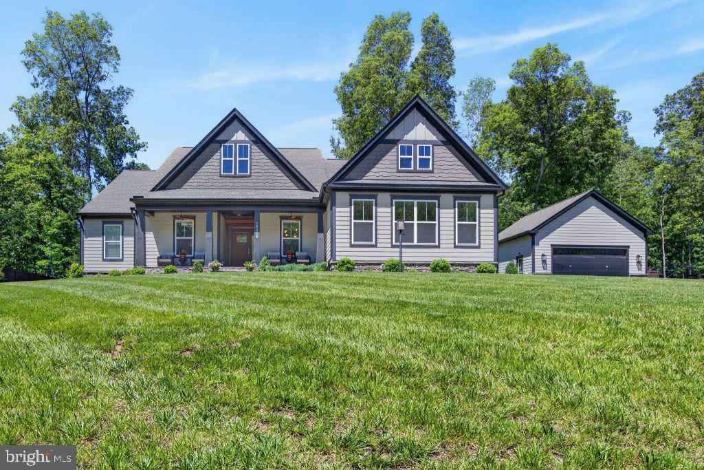 Atlantic Builder’s home on a 2.37 wooded acre lot in the highly desirable Reserve at Fallen Oaks. This private neighborhood of 22 homes provides a park-like setting yet is conveniently located near shopping and I-66. This 5,486 sq ft home has been extensively and tastefully enhanced to maximize privacy, aesthetics, storage, and indoor and outdoor entertainment. You will be greeted by a 3 board fenced property with nearly an acre of a managed wooded area out front that includes a walking path with bridged creek. The 200 ft driveway leads to the home and a 576 Sq Ft heated and air conditioned detached garage that includes solid wood cabinets and 240V power outlets. A 12 ft x 16 ft shed has been added with matching siding and roof. A large front porch and extensive landscaping decorate the front of the home. Inside you will be led to the great room with cathedral ceilings, a 13 ft tall stone fireplace, and plenty of natural lighting. The kitchen is a cook’s delight with a large gas cooktop, a double oven, and massive prep area. The space is enhanced with the optional long kitchen counter and sun room that adds to your family and guests comfort. The sun room is adjoined to a 20 ft long, 3 season screen room with a beautiful tongue and groove wood ceiling and mahogany railings and door. This room provides a breath taking view of the extensive patio, stone wall flower gardens and large stone fireplace. The open back yard leads to yet another wooded area of privacy that joins 10 acre wooded properties. Note that this property is almost completely surrounded with the 3 board fence and sections of privacy fencing. 1,100 ft of fencing adorn this property and give it charm and a ‘horse country’ feel. The lower level includes a huge 47 ft long recreation room that can accommodate a pool table and a game area along with a home theatre or upscale entertaining area. The forth bedroom, and a full bath complete the finished area. The storage side is 61 ft long and includes a full workshop, utilities, and massive storage. If you value privacy, sophistication, room for projects, and a designer’s touch, then put this home on your list. You won’t be disappointed.