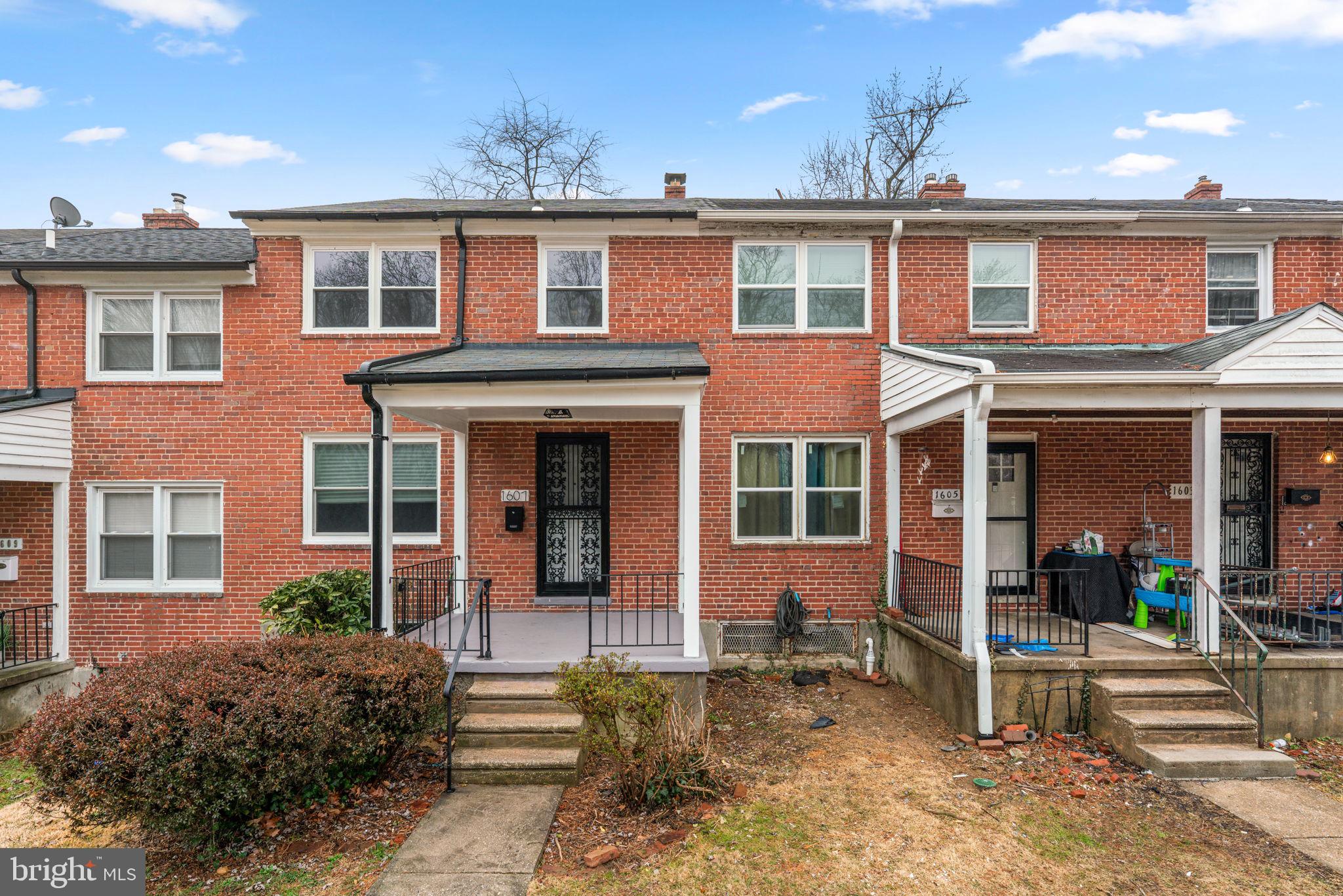 Welcome home to this flawlessly renovated brick townhome, where classic character meets contemporary design. Relax on your inviting front porch before stepping into a main level bathed in natural light and anchored by shimmering hardwood floors. The heart of the home is the chef-inspired kitchen, boasting crisp white cabinetry, quartz countertops, and a sleek subway tile backsplash, all complemented by premium stainless steel appliances and a gas range.

Entertain with ease in the formal dining room, featuring a stately bay window, crown molding, and elegant chair rails. Retreat upstairs to three spacious bedrooms and one full bath with continuous hardwoods, or head to the fully finished lower level. Outfitted with stylish LVP flooring, full bath and recessed lighting, this versatile space is perfect for a home office, gym, possible fourth bedroom, or media room. Outside, enjoy summer BBQs on your private rear deck within the safety of a fully fenced backyard. Freshly painted and completely move-in ready—this is the one you’ve been waiting for!