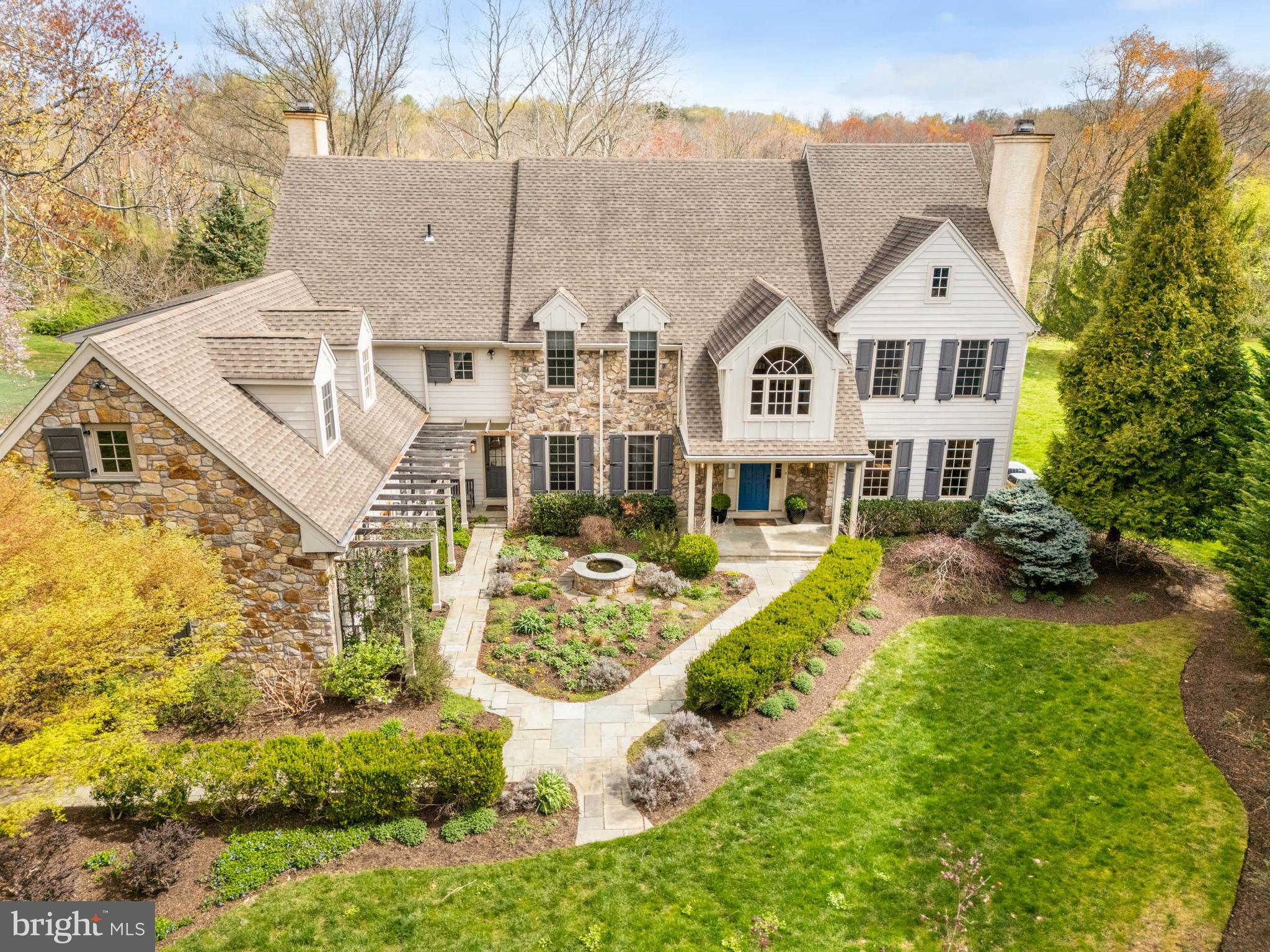 Nestled in the heart of Berwyn, Easttown Township, this special residence at 607 NEWTOWN ROAD offers privacy, elegance, luxury and comfort. Situated on nearly 2 bucolic acres of landscaped grounds, wonderful views, and gardens, this beautiful 5 Bedroom | 4 Full and 2 half bathroom Stone and Hardie plank siding home provides a welcoming presence from the street.  As you approach the front entrance, you will be greeted by inviting gardens, architectural details, and a soothing water feature.  The Front-to-Back Entrance Foyer greets you flanked by a formal Living Room with a handsome wood burning fireplace to your right, and a formal Dining Room to your left, setting a refined entertaining tone. A Formal Powder room is at the rear of the entrance foyer. The well-appointed Office/Study, with custom built-ins with a bar, hidden tv, and bookcases, offers a quiet, private space for working from home. Continuing on the main level, the updated, Gourmet Kitchen opens to the Breakfast Room and the grand Family Room with soaring ceilings, walls of large windows and a cozy, stone gas fireplace with flagstone hearth and built-ins.  Highlights of the kitchen include a Wolf gas range with double ovens, six-burners and a griddle; a SubZero Refrigerator with refrigerator drawers; a SubZero Freezer with freezer drawers; a SubZero wine refrigerator; a large island with granite counters, a built-in combined microwave/convection oven, a warming drawer, additional storage and room to sit and enjoy special family moments together; a coffee bar area with sink; custom cabinetry and Soapstone countertops providing ample storage for cookbooks, specialty appliances and serve ware. The mudroom provides direct, interior access from the 3-bay garage equipped with a proper outlet to charge your Electric Vehicle; the laundry room; the informal powder room; a command center with built-ins and a rear staircase to the 2nd level.      The wide staircase in the entrance foyer leads you to the sun-filled landing and the second floor. Upstairs is the Primary Bedroom with a cathedral ceiling, an adjacent dressing room with custom closets and flex space, two walk-in closets and  an en-suite bathroom with dual sink areas, a separate shower, a jetted tub, and a water closet with a Toto washlet toilet; bedroom # 2 with an en-suite and hallway access bathroom; Bedroom # 3 and Bedroom # 4 with a Jack-and-Jill bathroom; Bedroom # 5 with built-ins and a bonus room to suit your unique need; a built-in study area in the hallway; and walk-up access to the large, unfinished attic that could be finished for your  additional living needs.      The large, daylight, finished, lower level offers additional living and entertainment space featuring built-ins, a home entertainment area with wall-mounted tv; a full bathroom with shower; utility area and storage areas including wine storage.     Enjoy outdoor gatherings this summer with family and friends on your large, private deck, with a covered section, and a flagstone patio all overlooking the beautiful, private grounds.    The home was pre-inspected. Enjoy additional security and peace of mind with the gas generator for those inclement days.    This home is located in the highly sought-after Tredyffrin-Easttown School District with convenient access to major arteries; shopping and dining in Paoli, Berwyn, Devon and Newtown Square; and Hilltop Park.  607 NEWTOWN ROAD is ready to welcome its next owners as it delivers an elevated, suburban lifestyle perfect for family and entertaining. Don’t miss the opportunity to make this your new home   schedule your private appointment today!
