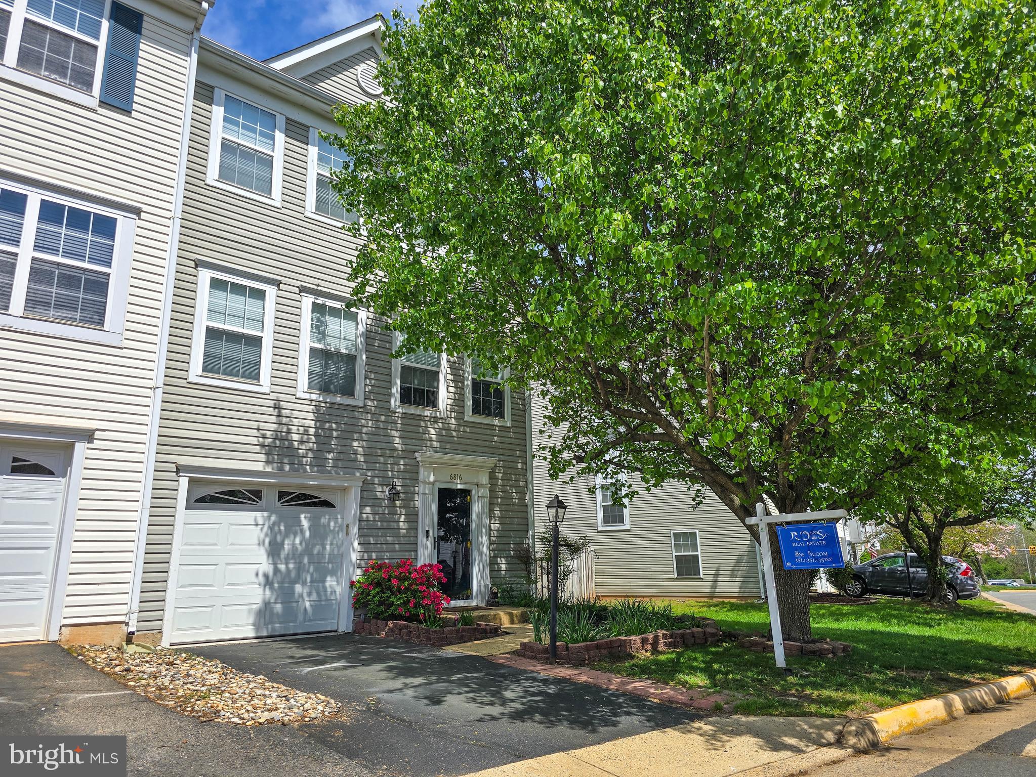 **MORE PHOTOS COMING** Welcome to this spacious and sun-filled end-unit townhome in the sought-after Crossroads Village community. Perfectly situated on a premium oversized lot, this home backs to trees and a wide open green space, offering both privacy and natural views. Inside, you’ll find three generous levels of living space, including 3 large bedrooms, 2 full baths, 2 half baths, and a one-car garage. The main level features a wide, open layout with multiple furniture arrangement options, hardwood flooring in the kitchen, and luxury vinyl plank flooring throughout. Enjoy outdoor living on the full-width deck or in the fully fenced backyard and side yard with a walk-out basement—ideal for entertaining, gardening, or relaxing. Assigned parking spot #109 conveys with the property.

This well-maintained home is full of natural light thanks to its additional end-unit windows and boasts numerous recent updates: roof and LVP flooring (2023), new carpet throughout (2025), Carrier air handler (2023), hot water heater (2025), refrigerator (2021), oven (2023), and microwave (2024). The finished lower level includes a welcoming foyer, half bath, and a flexible rec room perfect for gaming, a lounge, or home office space. With quick access to Routes 66, 15, and 29, plus close proximity to shopping, dining, and entertainment, this home offers the perfect blend of comfort, convenience, and location.