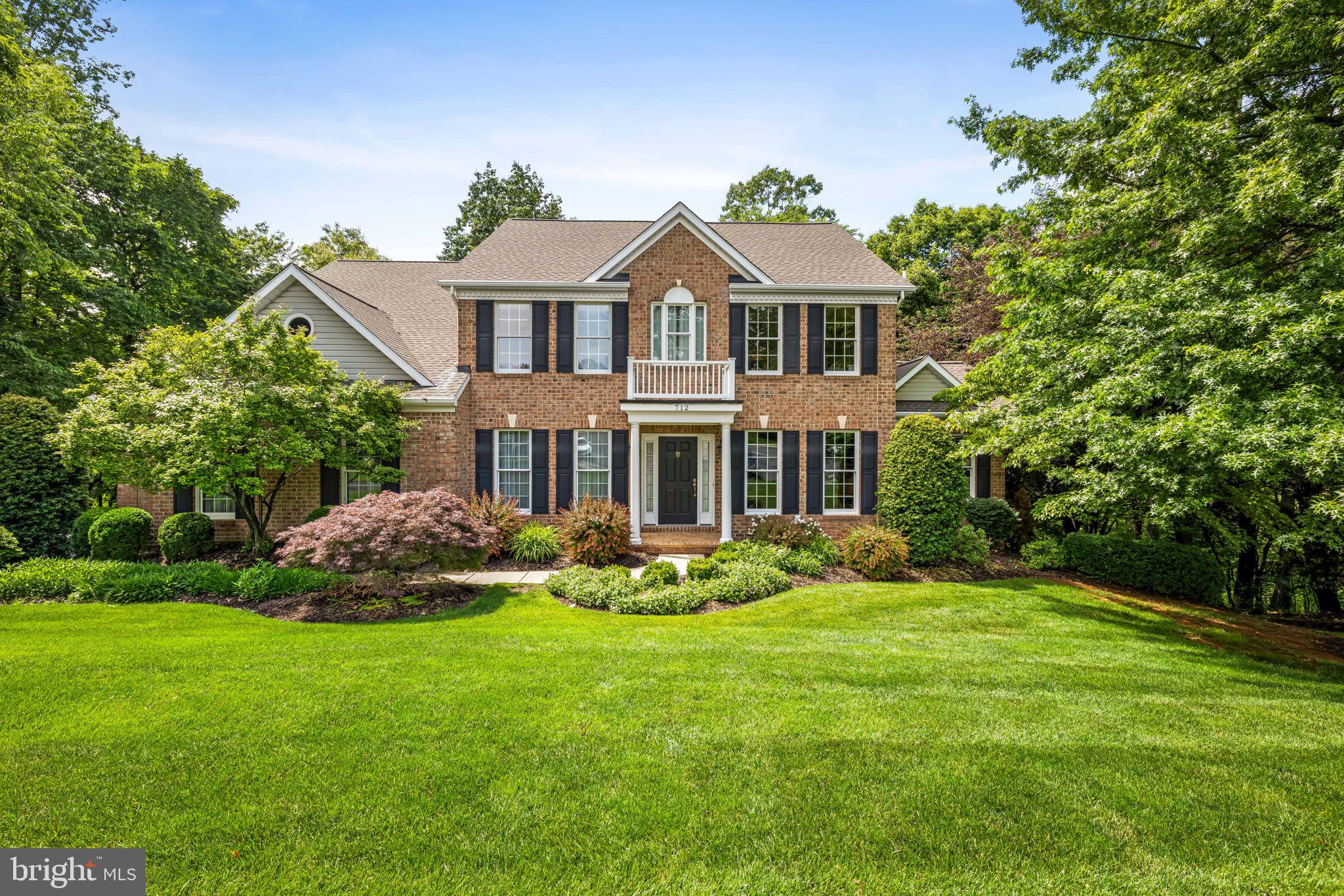 Welcome to this beautiful 5BR / 3.5BA home in the sought-after Cliveden Reach at Meadow Branch, ideally situated on a quiet cul-de-sac and a professionally landscaped, private lot. With over 4,000 square feet of thoughtfully designed living space, this home offers comfort, elegance, and room to gather, relax, and grow.
Step inside to hardwood floors, custom millwork, and vaulted ceilings that create an immediate sense of warmth. The welcoming foyer opens to a cozy library with custom built-ins—perfect for your favorite books and treasures—and a gracious dining room highlighted with chair rail and  picture frame molding. The heart of the home is the stunning two-story family room featuring a fireplace, wet bar, and peaceful views of the tree canopy. French doors lead to a spacious deck, creating effortless indoor-outdoor living. A quiet den provides a perfect retreat for reading, working, or unwinding.  The kitchen offers abundant cabinetry, dual wall ovens, breakfast bar and flows seamlessly into the bright breakfast room, which opens to a screened porch—ideal for morning coffee or relaxing evenings. A main-level laundry room and private office add everyday convenience and functionality.  Upstairs, the luxurious primary suite is a true retreat, complete with walk-in closets and a spa-inspired bath. Three additional generously sized bedrooms share a well-appointed hall bath.  The walk-out lower level expands the living space with a large recreation room, bedroom, full bath, walk-in storage, and utility room—offering wonderful flexibility for guests, hobbies, or entertaining.  Enjoy outdoor living surrounded by beautiful landscaping and a private wooded setting, with both a screened porch and expansive deck. Conveniently located near shopping, dining, schools, commuter routes, golf, and the trails of Hashawha—this special home truly offers it all.