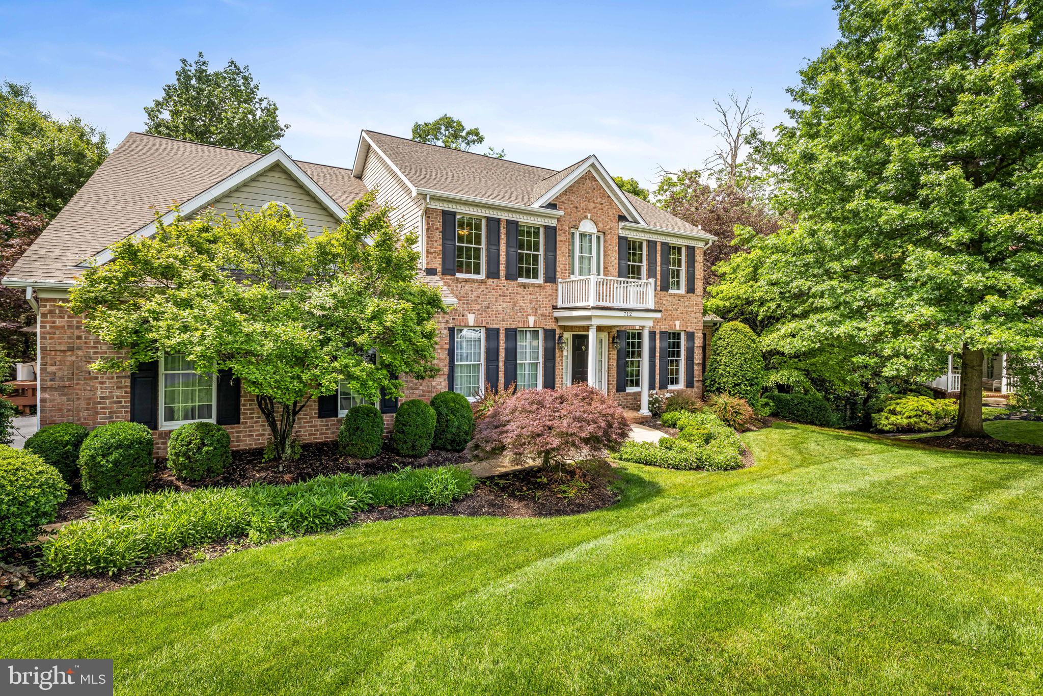 Welcome to this beautiful 5BR / 3.5BA home in the sought-after Cliveden Reach at Meadow Branch, ideally situated on a quiet cul-de-sac and a professionally landscaped, private lot. With over 4,000 square feet of thoughtfully designed living space, this home offers comfort, elegance, and room to gather, relax, and grow.
Step inside to hardwood floors, custom millwork, and vaulted ceilings that create an immediate sense of warmth. The welcoming foyer opens to a cozy library with custom built-ins—perfect for your favorite books and treasures—and a gracious dining room highlighted with chair rail and  picture frame molding. The heart of the home is the stunning two-story family room featuring a fireplace, wet bar, and peaceful views of the tree canopy. French doors lead to a spacious deck, creating effortless indoor-outdoor living. A quiet den provides a perfect retreat for reading, working, or unwinding.  The kitchen offers abundant cabinetry, dual wall ovens, breakfast bar and flows seamlessly into the bright breakfast room, which opens to a screened porch—ideal for morning coffee or relaxing evenings. A main-level laundry room and private office add everyday convenience and functionality.  Upstairs, the luxurious primary suite is a true retreat, complete with walk-in closets and a spa-inspired bath. Three additional generously sized bedrooms share a well-appointed hall bath.  The walk-out lower level expands the living space with a large recreation room, bedroom, full bath, walk-in storage, and utility room—offering wonderful flexibility for guests, hobbies, or entertaining.  Enjoy outdoor living surrounded by beautiful landscaping and a private wooded setting, with both a screened porch and expansive deck. Conveniently located near shopping, dining, schools, commuter routes, golf, and the trails of Hashawha—this special home truly offers it all.