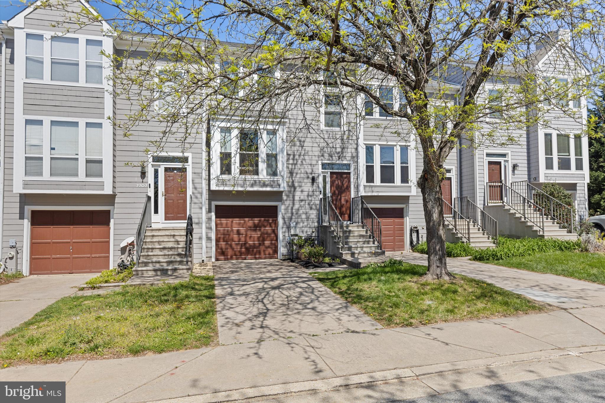 Stunning Townhome in Woodland Village with garage and so many updates! Updates include new kitchen in 2020, new Roof in 2022, new windows and sliders 2022, new primary bathroom in 2022 , washer and dryer 2025,and freshly painted in 2023. This home features 3 levels of finished living, gallery kitchen open to ample dining area and large living room with has 2 sliders to enter the rear deck. Lower level family room has a fireplace (fire box was replaced in 2023) walk-out to patio and garage entrance. Upper level stairway offers tons of natural light, 3 bedrooms, hall bath has new vanity and sink, primary bedroom has vaulted ceilings, new fan and closet organizer. Sellers also added spray foam insulation under stairs closet and air sealed and insulated the attic. This is a move in ready home!