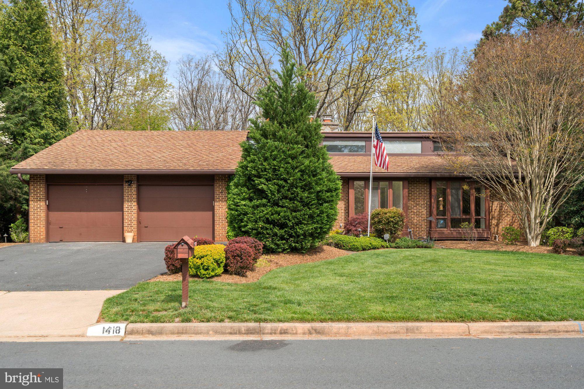 Charming home in the Wolf Trap Woods community, on a private 0.36-acre lot! This home offers 5 bedrooms, 3.5 baths, and 3,334 finished square feet across two spacious levels. This home features thoughtful details throughout with clerestory windows, custom built-ins, and recessed lighting. An entryway pond with waterfall and beautiful double doors welcome you inside to a cathedral ceiling foyer, living room, and formal dining room. The living room features an impressive wood burning stone fireplace. Spacious kitchen with plenty of cabinetry flows seamlessly into the breakfast room. The breakfast room includes large bay windows, skylight, and screen door leading outside to a perfect outdoor dining area. The owner’s suite includes private dressing room, walk-in closet, ensuite bathroom, vaulted ceilings, and attached sitting room with spiral staircase leading downstairs. The main level also features additional bedroom and office with custom built-ins, full bath, entryway half-bath and laundry room. Walk-out lower level is perfect for entertaining or relaxing, with large recreation room featuring another beautiful stone wood-burning fireplace, billiard’s room withn pool table, and another two bedroom and full bathroom that’s perfect for guests. The lower level also features a large storage and workshop area that is perfect for all your hobbies! Enjoy outdoor living on the back deck, patio under deck providing shade, well maintained backyard, and mature trees great for privacy. Two car-garage with driveway parking space suited for multiple cars. All of this in a prime Vienna location, close to the Wolf Trap National Park for the Performing Arts Amphitheater, local parks, downtown shops, restaurants, and the Metro. Colvin/Cooper/Langely Pyramid.