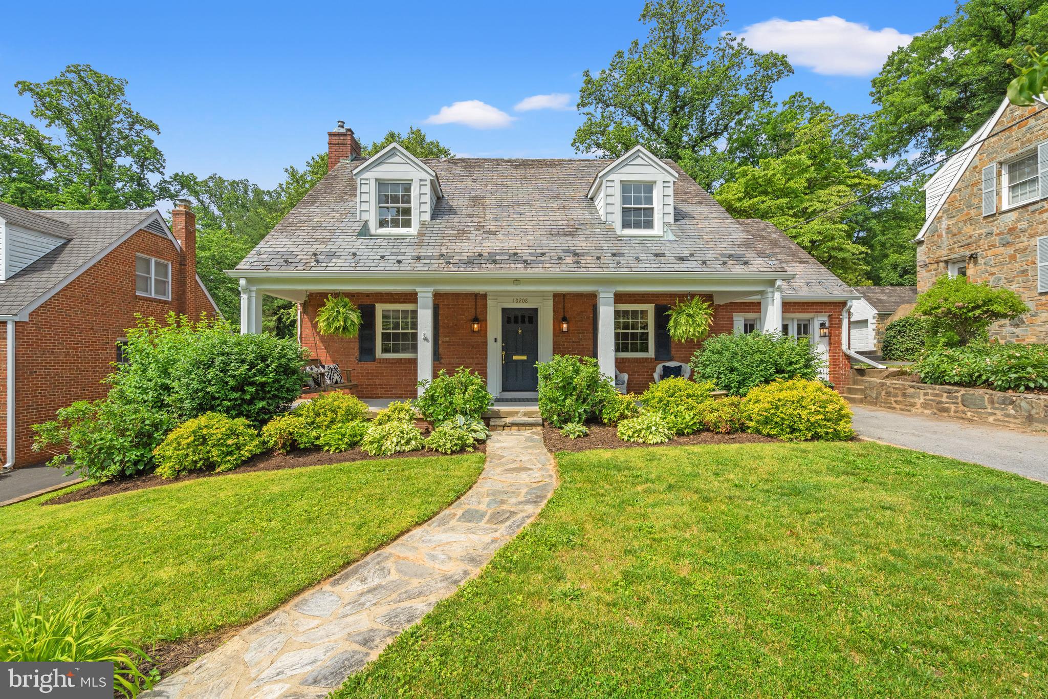 FIRST OPEN! SUNDAY JUNE 7th 1:00 pm-3:00 pm
Welcome to 10208 Edgewood Avenue in Northwood Park! This Cape Cod style home with over 2300 Total square feet home is filled with character, beautifully landscaped and set on a large .23 acre lot.  A full width front porch welcomes you to this charming 1940 home. Enter on the main level into the living room with fireplace and hardwood floors, gorgeous renovated kitchen with quartz countertops, large island and dining space, family room with built in storage  and built in corner desk, and a half bath. New windows!
On the second level, there is a large primary bedroom, 2 additional bedrooms and a full bath. The refinished hardwood floors are throughout the second level.
The lower level recreation space is finished with built-in shelving and storage, a flex office space, a full bath and laundry.
A spacious flat back yard contains play structure and 2 storage sheds.  Driveway parking for 2 cars.
One block to North Four Corners Park and  convenient to Woodmoor Shopping Center.