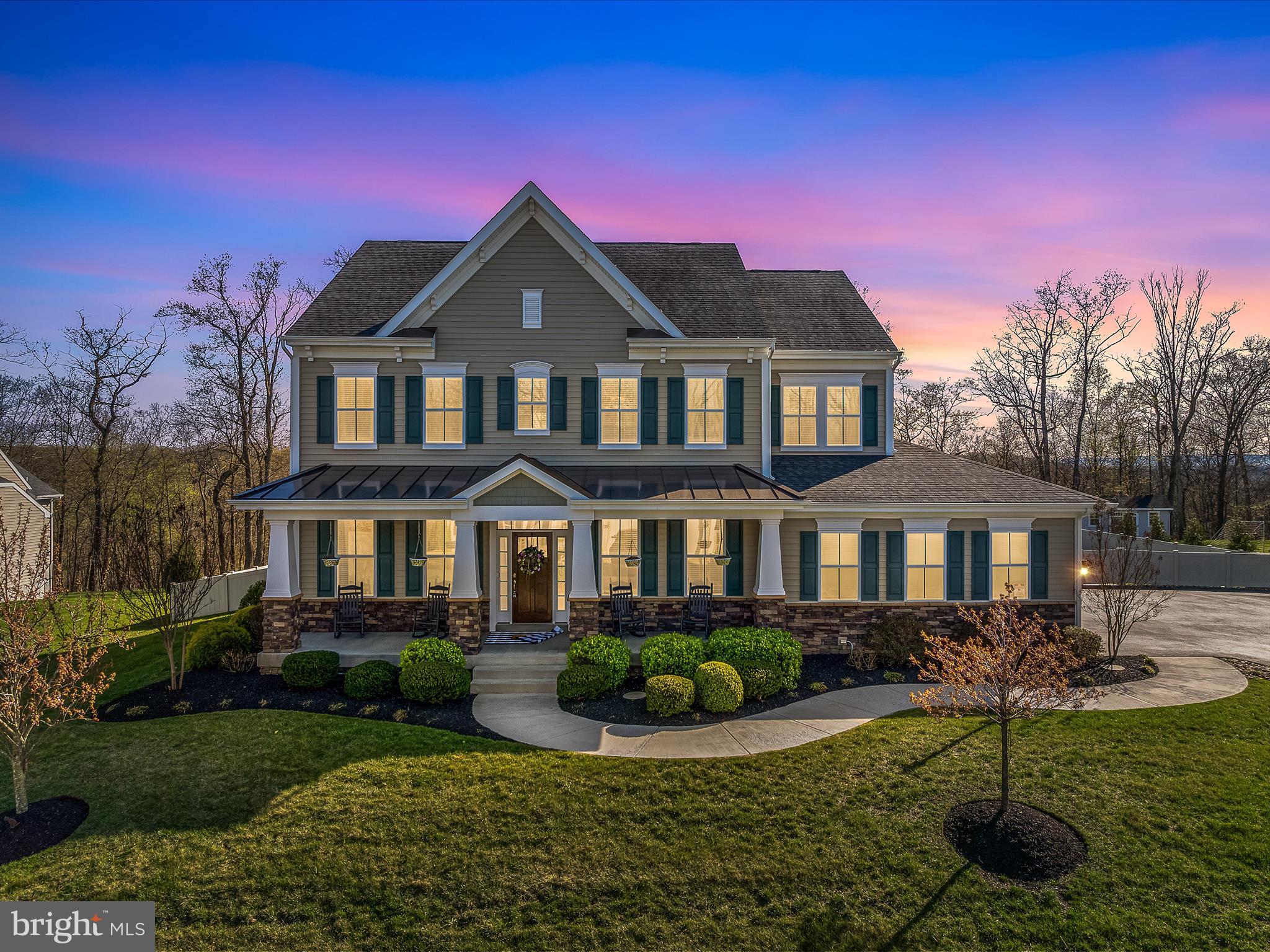 Welcome to 258 Tributary Trail, a stunning residence that offers an abundance of space and luxurious features. This exquisite home boasts six spacious bedrooms, including a convenient main-level suite, and five and a half elegantly appointed bathrooms. The fully finished walk-out basement is perfect for entertainment, featuring a dedicated theater room and bar. Main level includes large family room and a modern kitchen with an oversized island, ideal for gatherings. 

Additional highlights include two well-equipped laundry rooms and a generous screened-in patio that overlooks a beautifully landscaped yard. The outdoor oasis features a heated saltwater pool, perfect for relaxation and recreation. 

Residents of Brookfield on the Potomac enjoy exclusive amenities, including a boat launch, picnic pavilions, grills, and fire pits, creating a vibrant community atmosphere. Don't miss the opportunity to make this exceptional property your new home!