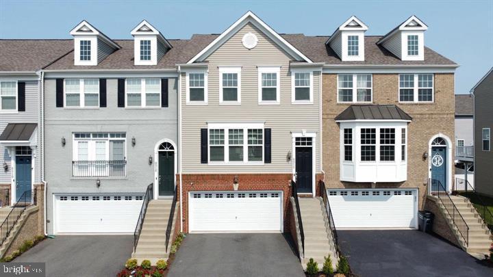 Welcome to this lovely H.O.M.E! Absolutely stunning & an incredible home located in the most coveted neighborhood of Manassas built by a renowned builder in the nova area! This home is bustling with lovely upgrades throughout! Open doors to a Sun lit & bright open space floor plan. Hardwoods exude a legacy feel in the entryway, living areas, and kitchen, beneath a rare combination of stylish and natural lighting. The gourmet chef-inspired kitchen features granite/quartz counters and upgraded stainless steel appliances! A classic island configuration maximizes workspace and flexibility. The floor plan  opens to deck for you to enjoy your evenings with wine, coffee or morning cups of tea as well as grilling out on weekends with family & friends! The upper level has 3bedrooms with 2 full baths & Laundry. Incredible master br has plenty of walk-in closet space to let your wardrobe breathe. The finished walkout basement, can be used as a rec room or multi purpose room & has a half bath.  It also opens up to Vinyl fence & lovely patio. 2 car garage with lots of parking in the community! The home is mere minutes from various shopping/dining destinations (Davis Ford Crossing Shopping Center, Signal Hill Shopping Center, and Manassas Shopping Center), and the natural allurements of Signal Hill Park. "Be right there" radius also includes schools (Bennett Elementary School, Parkside Middle School, and Osbourn High School). Don't miss this special Manassas opportunity among the contemporary construction of the gated Bradley Square development in the Historic District neighborhood! Come fall in love & Schedule your showings NOW!