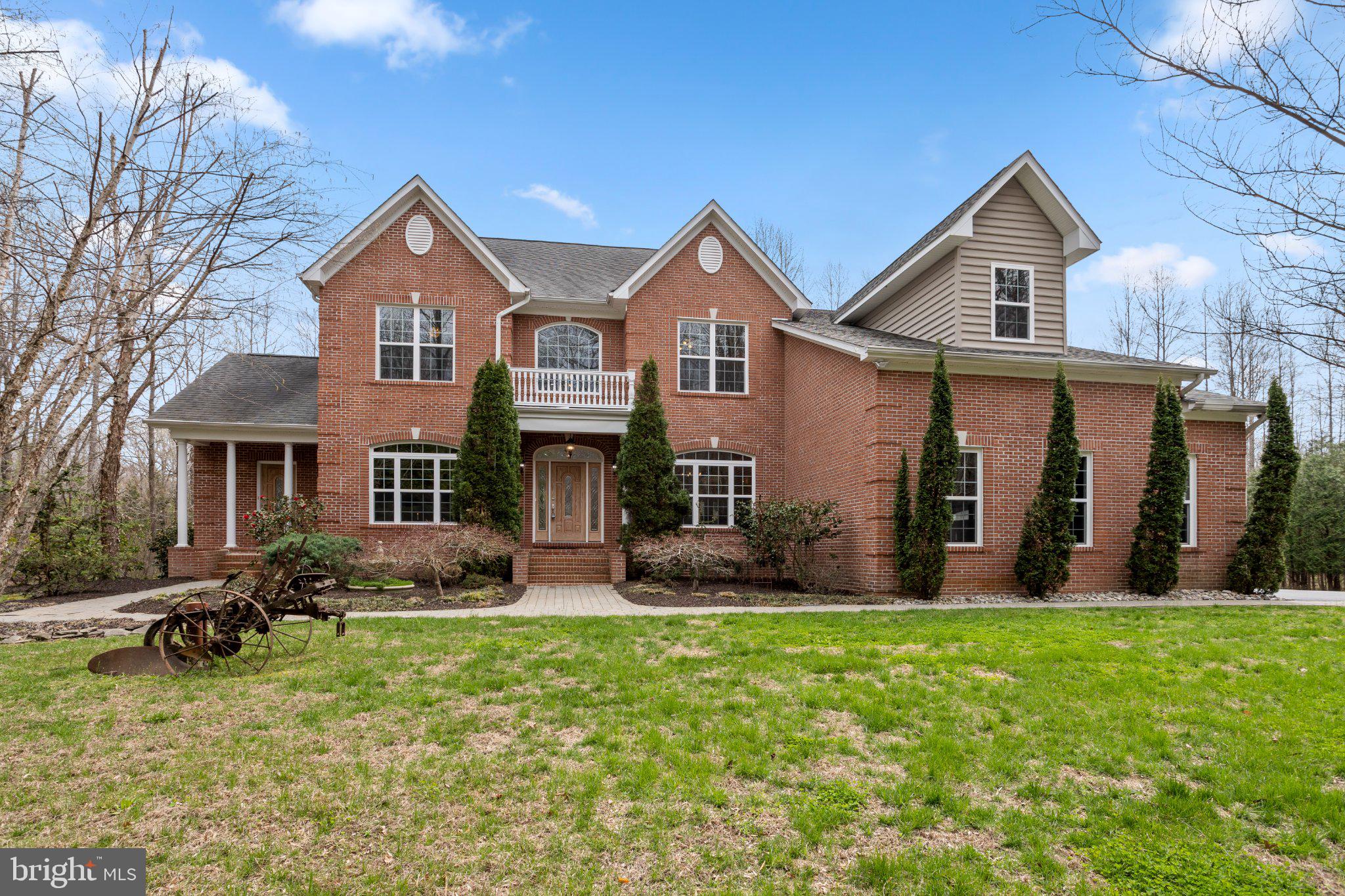 GEOTHERMAL Home on a paved private lane in the Anne Arundel County portion of Owings. Set behind a beautiful brick pillar entrance on 2.58 serene acres, this property offers privacy, mature evergreen borders, a spacious yard, and a Fenced section for added versatility. Relax on the peaceful back deck overlooking the natural beauty that surrounds the home. As you drive through the brick pillars, the custom design and grand presence of this property immediately stand out. This impressive home also features an attached in-law apartment, ideal for multi-generational living. A long private driveway provides ample parking, complemented by a 3-car garage in excellent condition. Step inside the front main entrance, you are welcomed by a grand front entrance, soaring ceilings, a grand staircase, and abundant natural light throughout. The 2026 refinished wide-plank hardwood floors on the main lower level add warmth and elegance. Enter from the garage through the mudroom into the open-concept kitchen and living area, where large doors lead directly to the back deck. A second staircase located near the mudroom meets the grand foyer staircase for added convenience. The gourmet kitchen is designed for both everyday living and entertaining, featuring granite countertops, custom cherry cabinetry, under-cabinet lighting, stainless steel appliances, a gas stove, double wall oven/microwave combo, wine fridge, two dishwashers, and a bonus island bar sink perfect for hosting. Special features throughout the home include with a turn of a key, a lowering grand foyer chandelier for easy cleaning, a whole-home sprinkler system, built-in speakers connected to the TV, and a whole-home Bluetooth sound system on both levels, DUAL ZONE HVAC system, Built-in Generator, Custom recessed and directed lighting throughout,  and 2 FIREPLACES (propane). There is also a holiday lighting package with built-in window lights for all year elegance, exterior holiday dedicated outlets, all conveniently wired to a switch. Elegant Formal dining room with plenty of space for family gatherings. Upstairs, the primary suite is truly a retreat, filled with natural light and featuring a custom barn door leading to a private flex room currently used as a workout/hobby space. This area also includes a safe that conveys and room for a sitting area with peaceful views of the front yard’s birch trees. The luxurious primary bath features heated floors, two separate vanities, two walk-in closets, a private water closet, and an expansive walk-in shower with dual entrances, lighting, and exhaust. The upper level includes four bedrooms, a central living area, and three full baths, including the primary bath. One of the secondary bedrooms has its own private full bath.
Additional highlights include stunning crown molding, built in CAT5 in most rooms, a charming formal dining room filled with natural light, and a large unfinished basement with high ceilings, pristine condition, and preparation for future expansion. The basement has been waterproofed and the home includes a French drain system installed at the time of construction for added protection. The attached in-law/multi-generational living space is thoughtfully designed with its own full kitchen, dining room, living room, bedroom, full bath, front entrance, finished staircase, and separate basement access. This home reflects thoughtful craftsmanship, quality design, and attention to detail at every turn. A rare opportunity to own a private, feature-rich property that truly has it all. Located minutes from North Beach TRAILS & HIKING, Chesapeake Beach,  Herrington Harbour North & South, ONLY 6 MILES TO THE NORTH BEACH BOARDWALK AND BEACH, and a variety of restaurants, shopping, parks and recreation. (21.5 miles) to JOINT BASE ANDREWS,  (26.6 MILES) TO NAVAL ACADEMY ANNAPOLIS, (41.2 MILES) TO PAX RIVER, (38.7 MILES) TO FORT GEORGE G. MEADE, AND (32 MILES) TO THE PENTAGON ***Pool is AI Generated, not deemed viable.